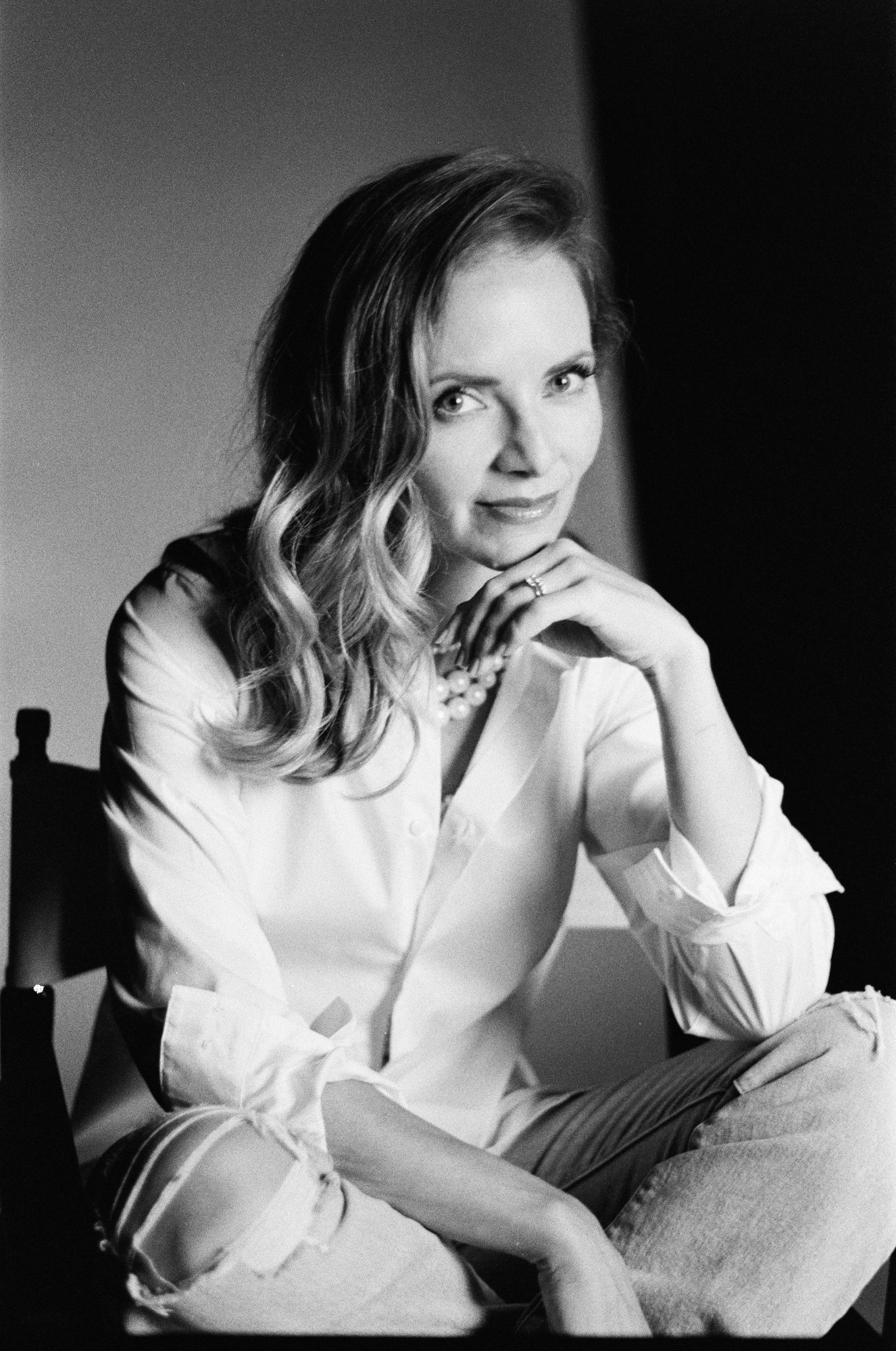 Sarah Smith-Podollan in a white shirt in a black-and-white film portrait