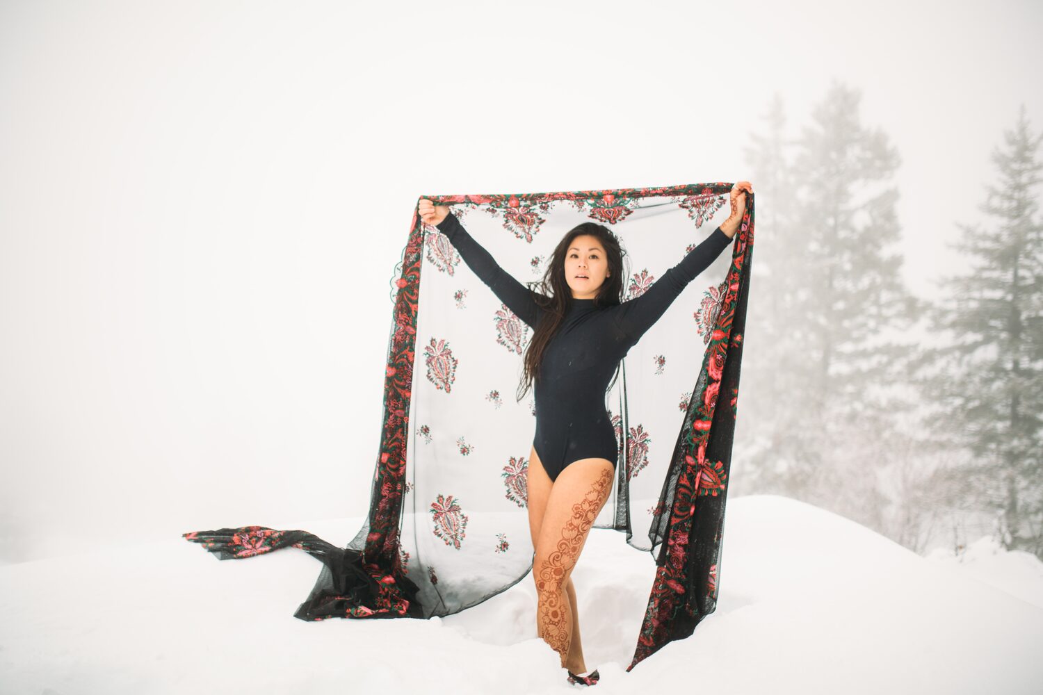 Sarah: Henna, Snow and Candlelight portraits story frame 16: A four-part portrait story with Sarah in Kelowna, moving from a living-room henna session into snow, a daylight coconut-milk bath and a candlelit bath.