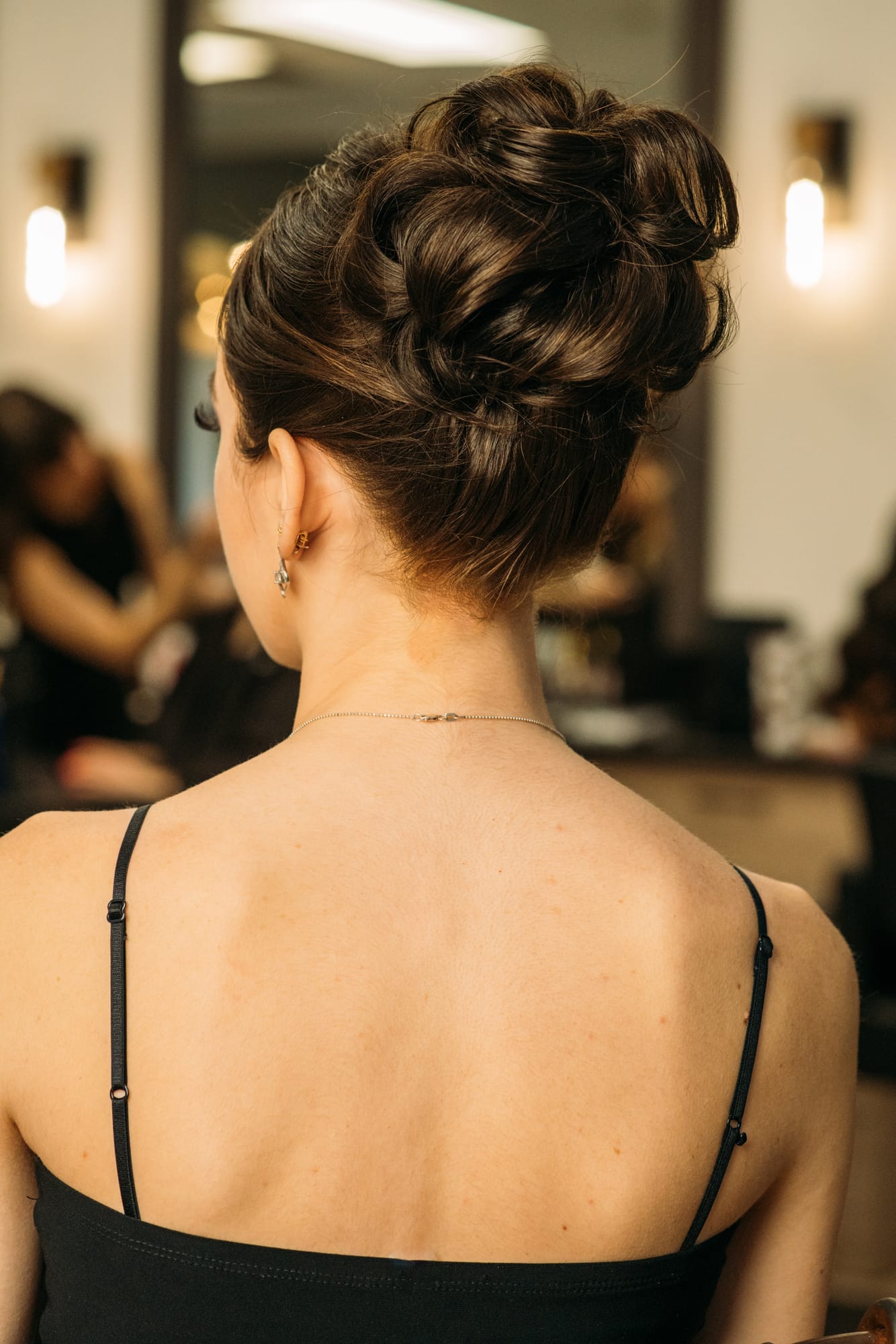 Sass Hair and Diva Den corporate story frame 6: Special-event, prom and grad beauty portraits for Sass Hair and Diva Den in Kelowna, with finished hair, makeup, salon atmosphere and polished vendor images..