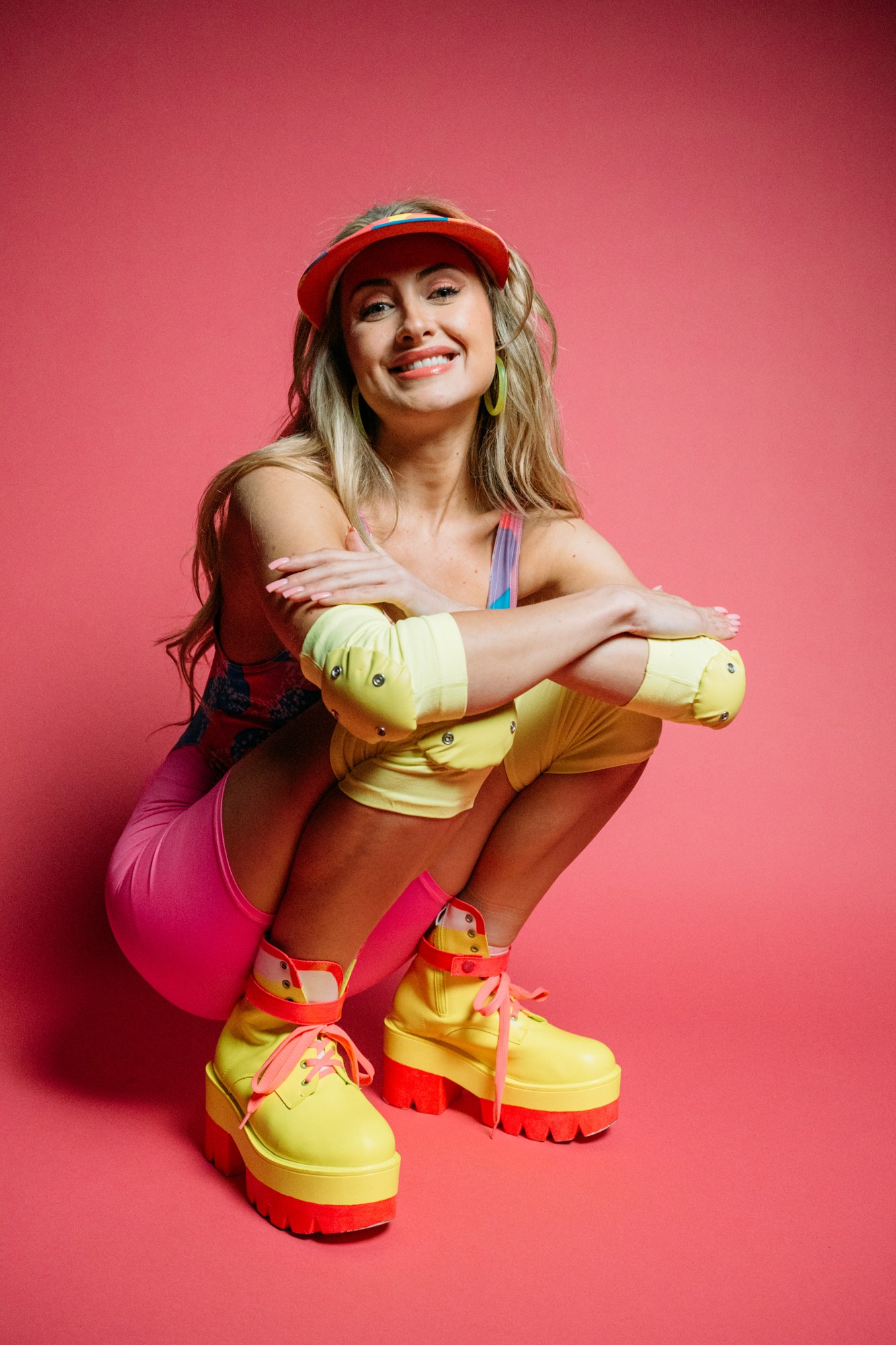 Shanelle crouching and smiling on her roller skates