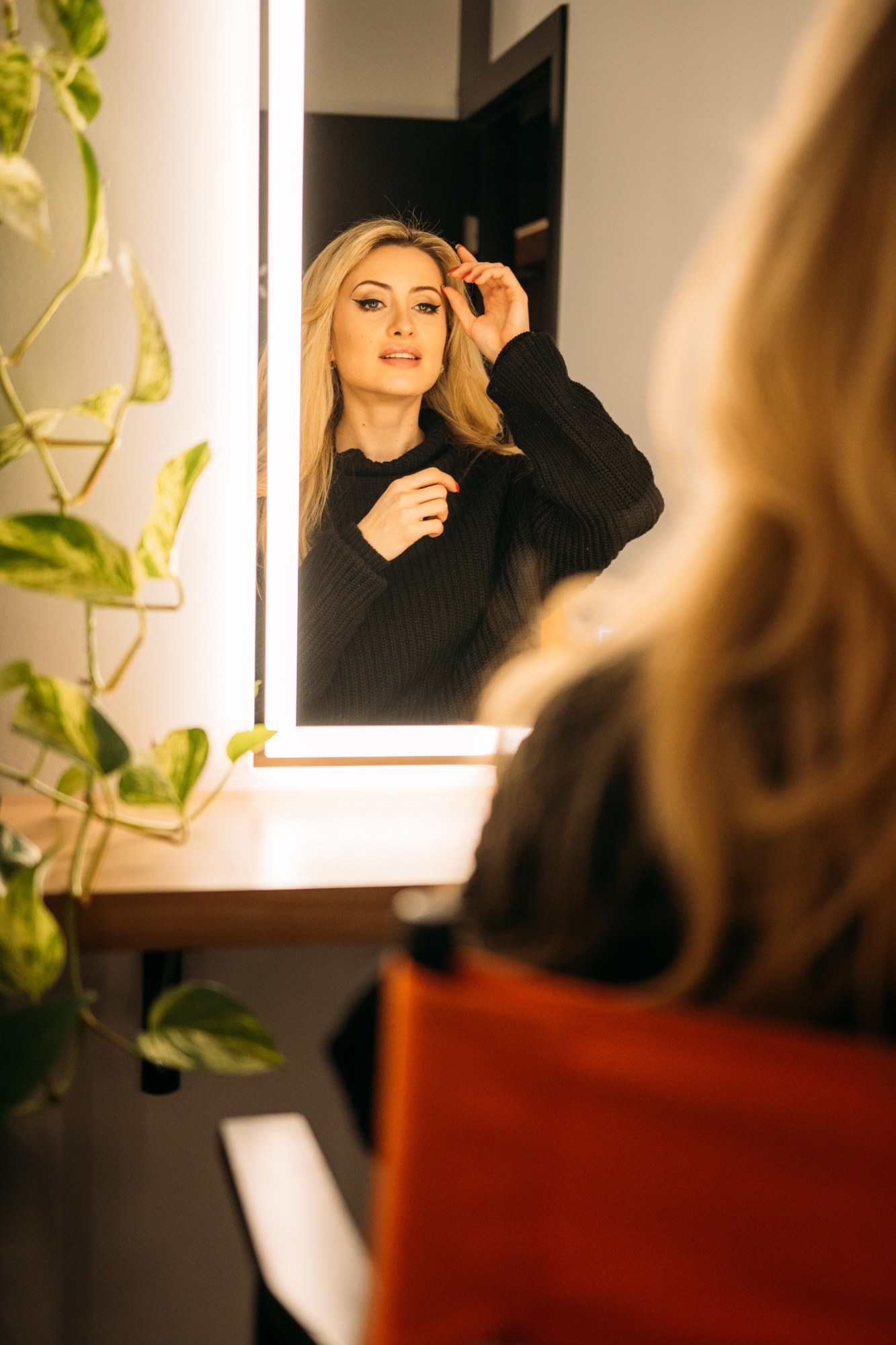 Shanelle Connell smiling in a studio mirror