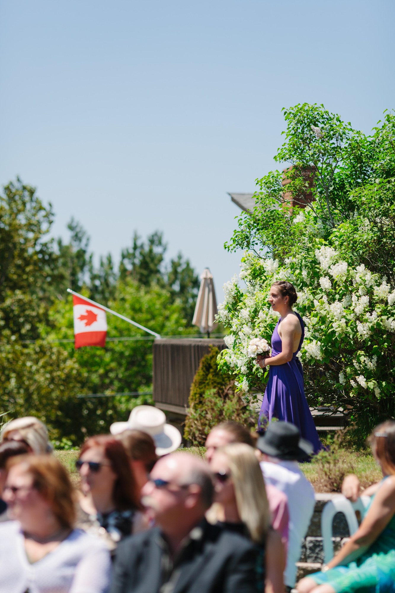 Shannon & Ehren: A bridesmaid walking toward the ceremony.