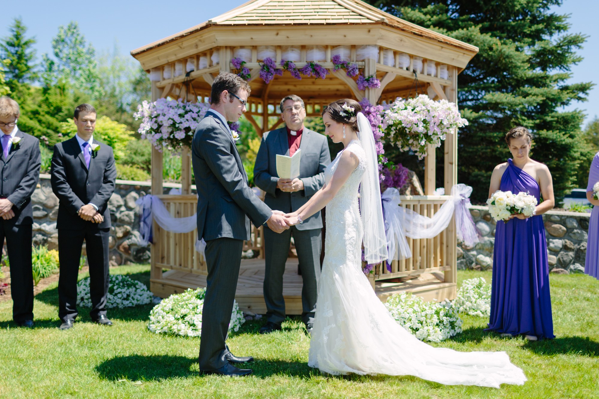 Shannon & Ehren: The couple holding hands during the vows.