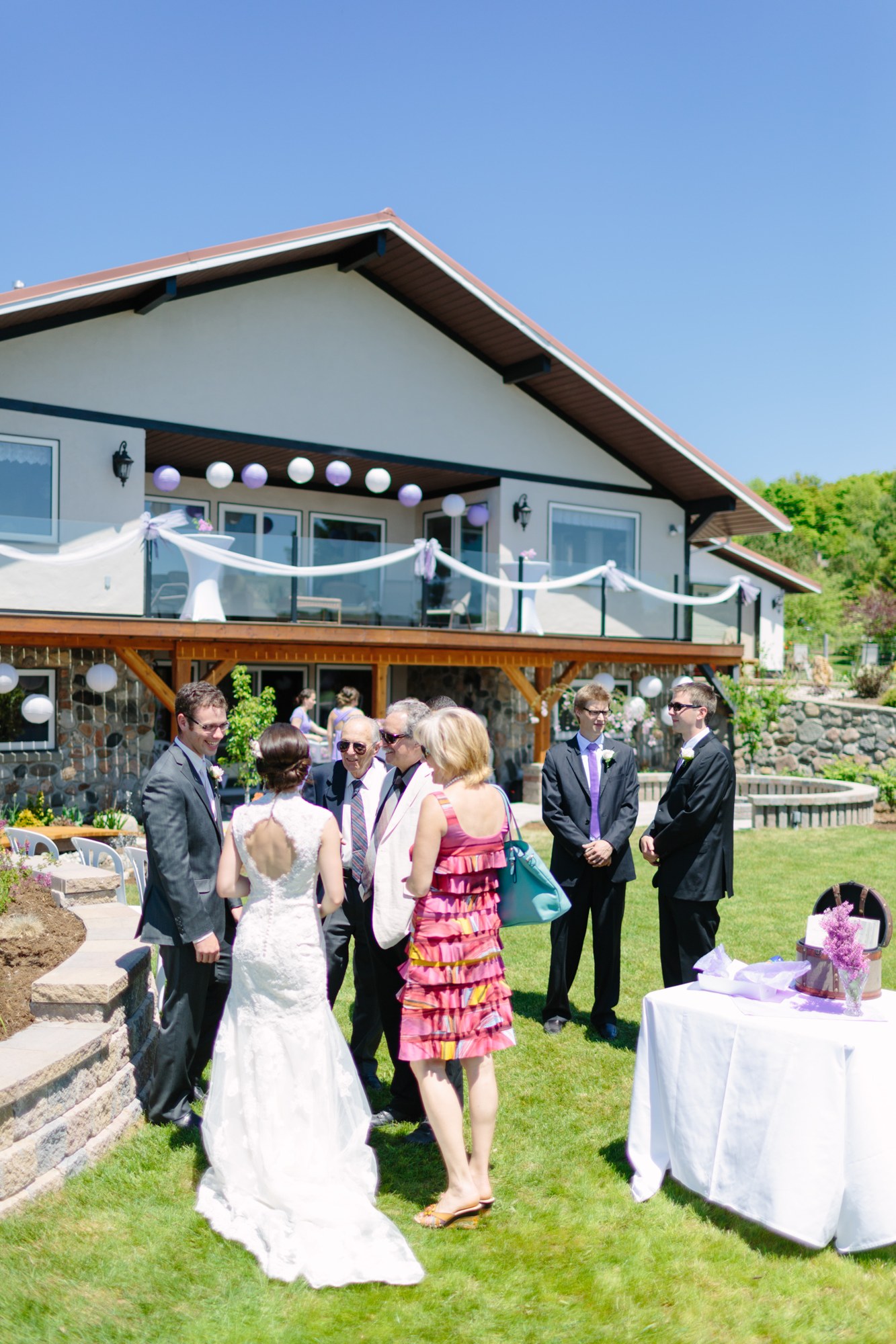 Shannon & Ehren: The bride greeting guests on the lawn.