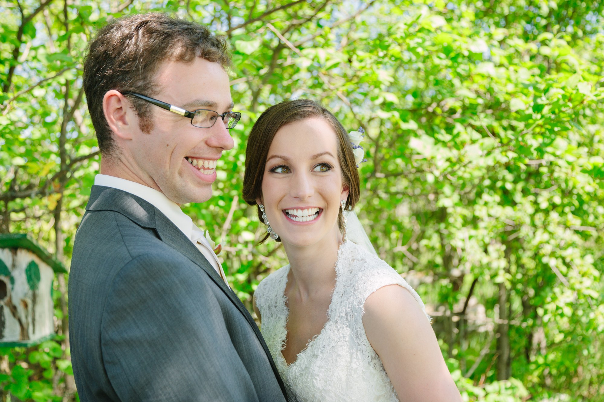 Shannon & Ehren: The bride smiling beside the groom.