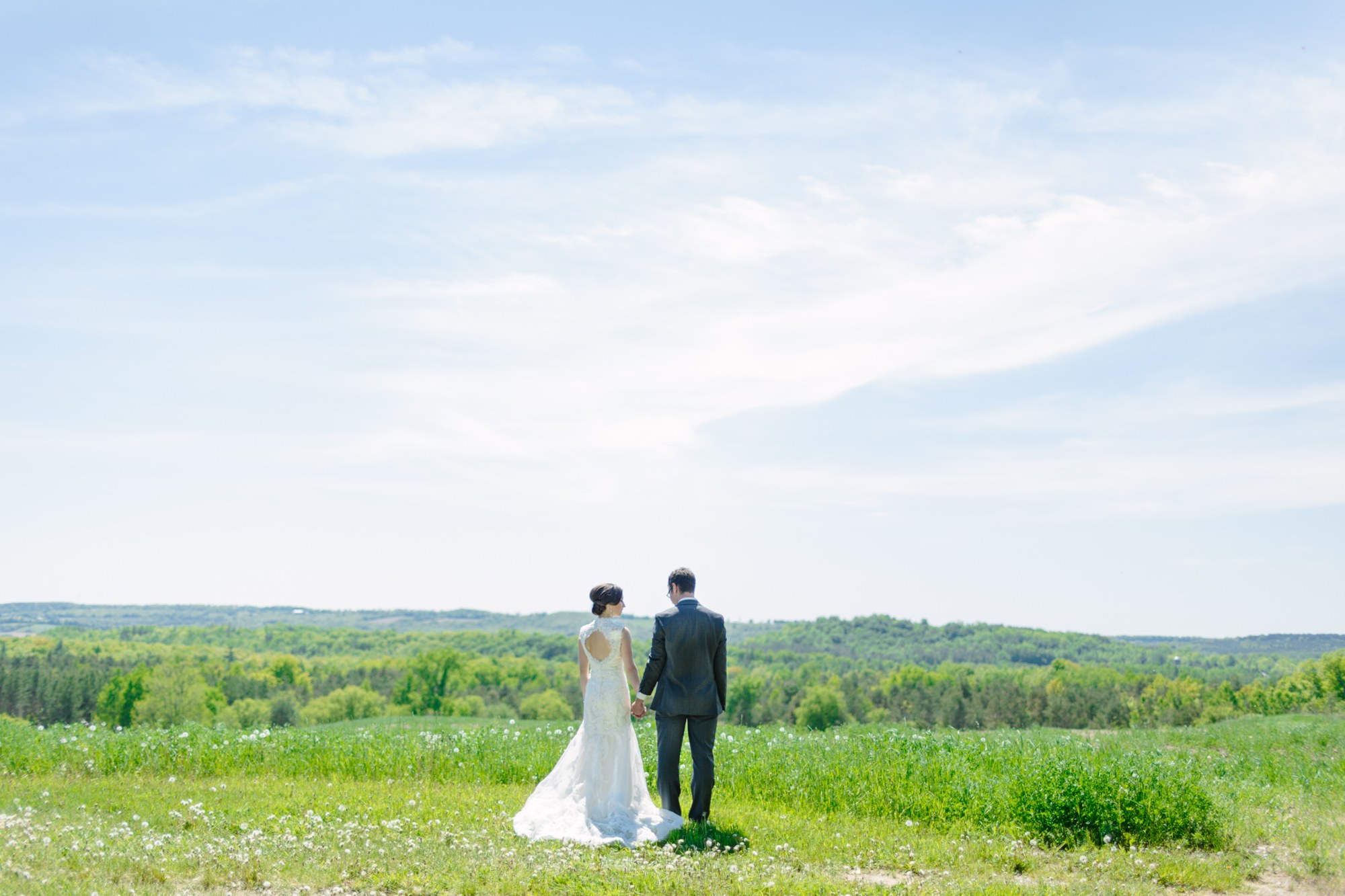 Shannon & Ehren: Wide couple portrait overlooking the countryside.