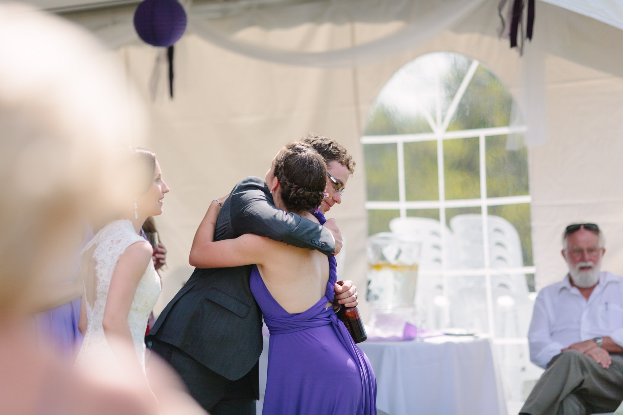 Shannon & Ehren: A warm embrace beside the reception tent.