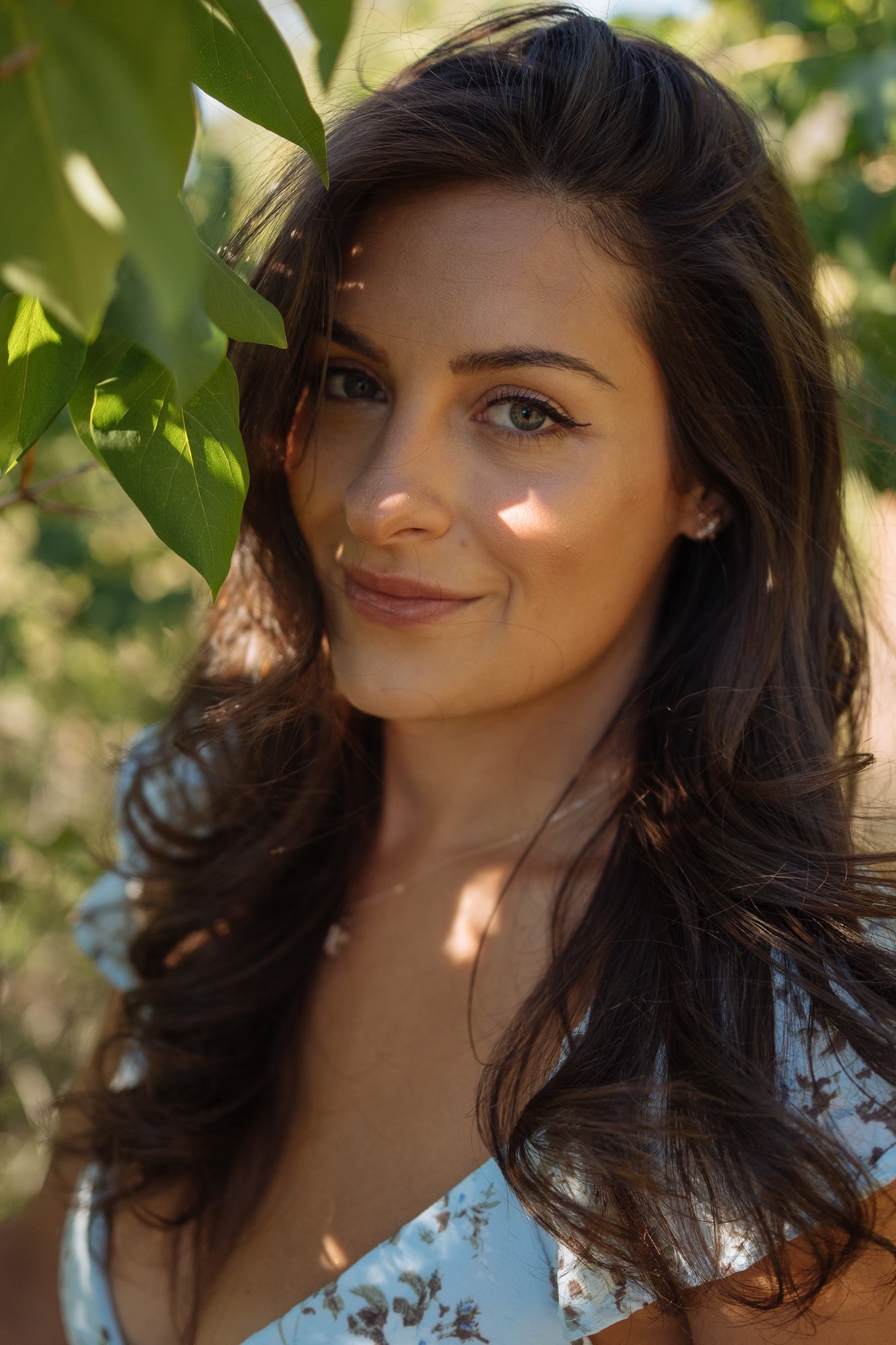 Shatille — close portrait framed by green leaves