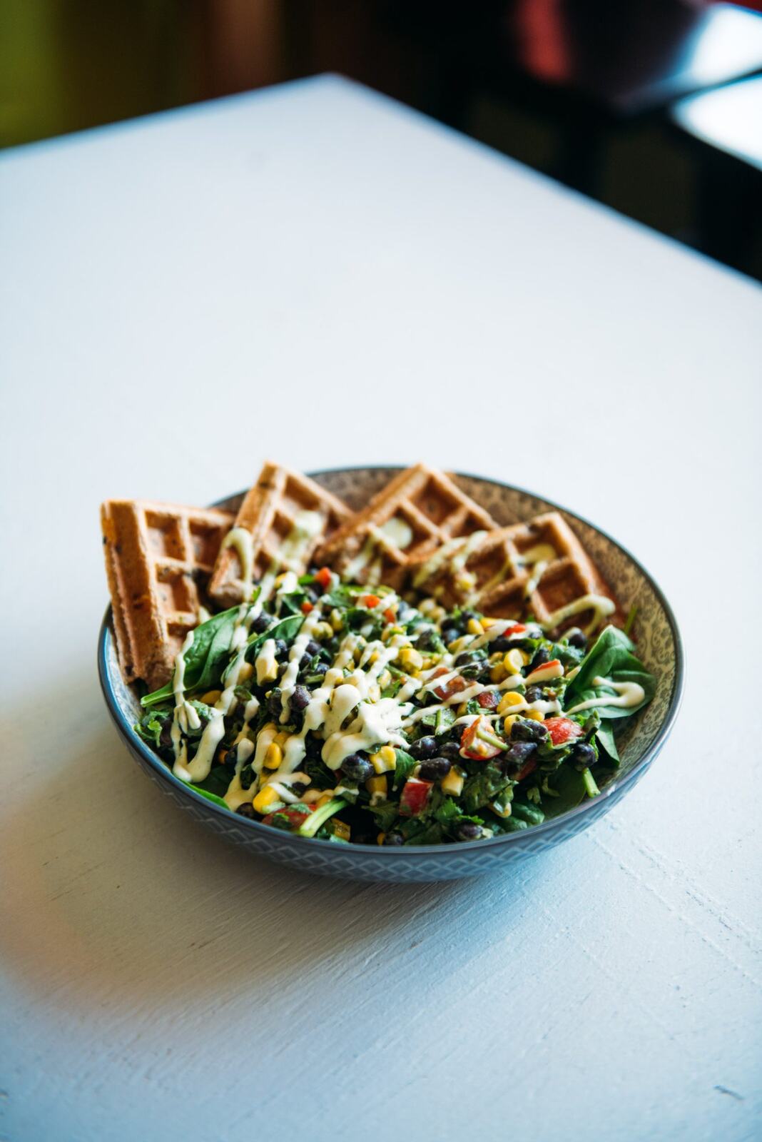 Smudge Noshery corporate story frame 12: Food and hospitality brand photography for Smudge Noshery in Salmon Arm, BC, with colourful flatlays, smoothies, bowls, cafe details and commercial product images for a local restaurant..