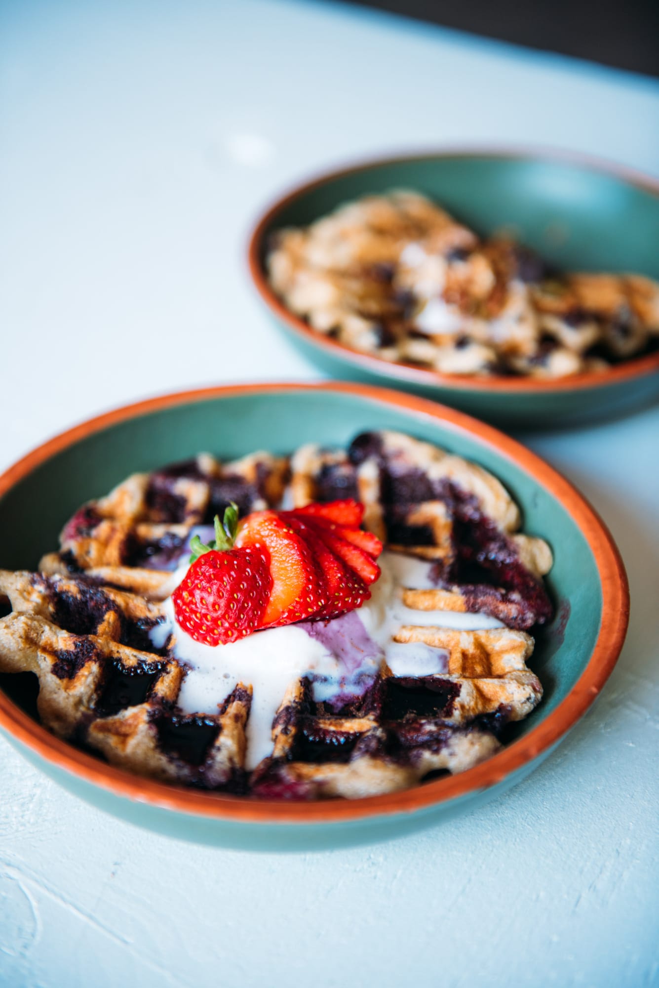Smudge Noshery corporate story frame 34: Food and hospitality brand photography for Smudge Noshery in Salmon Arm, BC, with colourful flatlays, smoothies, bowls, cafe details and commercial product images for a local restaurant..