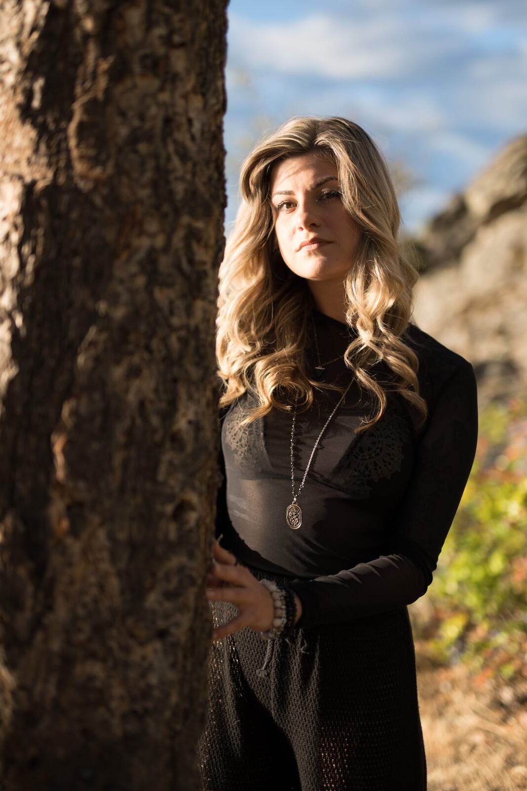 Sophia by the Water and Trees portraits story frame 3: Black outfits, water, trees, swimwear and a confident, sensual portrait story.