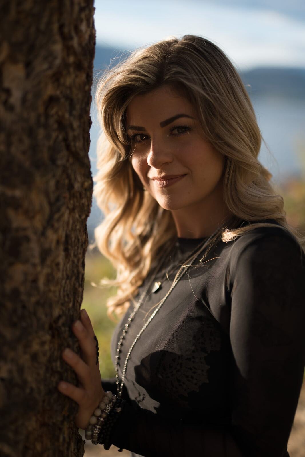 Sophia by the Water and Trees portraits story frame 4: Black outfits, water, trees, swimwear and a confident, sensual portrait story.