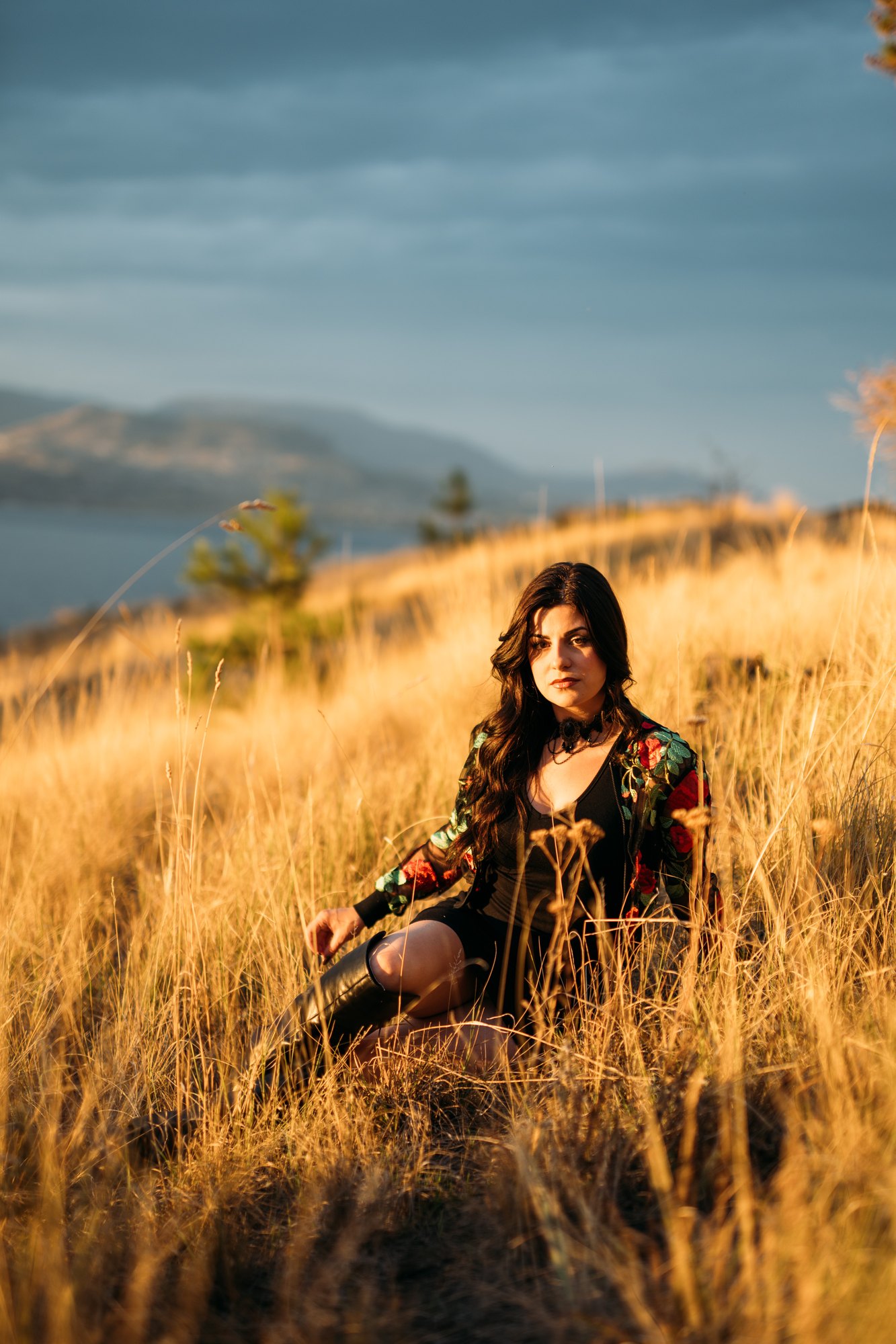 Sophia — a wide seated portrait in the golden grass