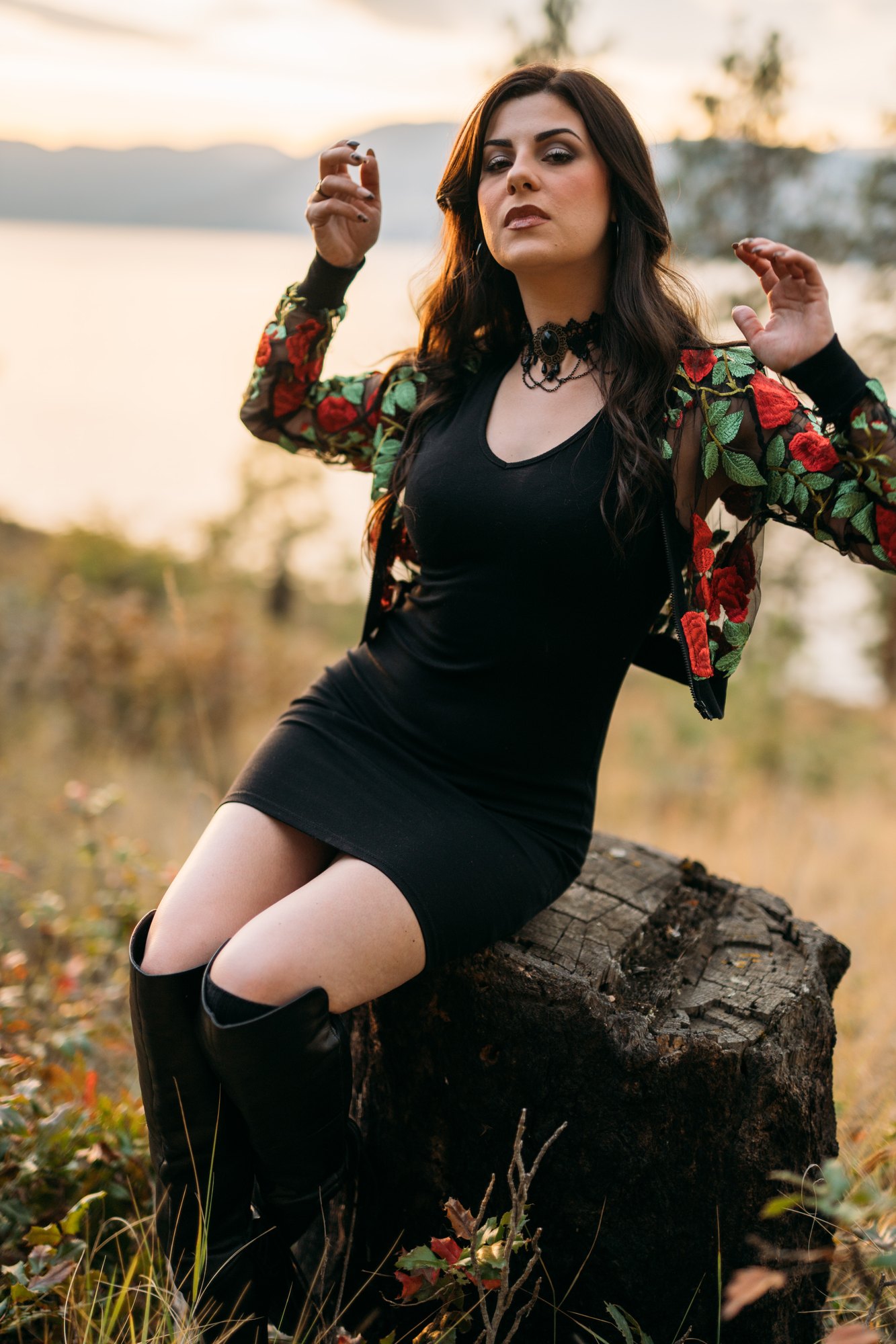 Sophia — sitting on a tree stump in the floral jacket