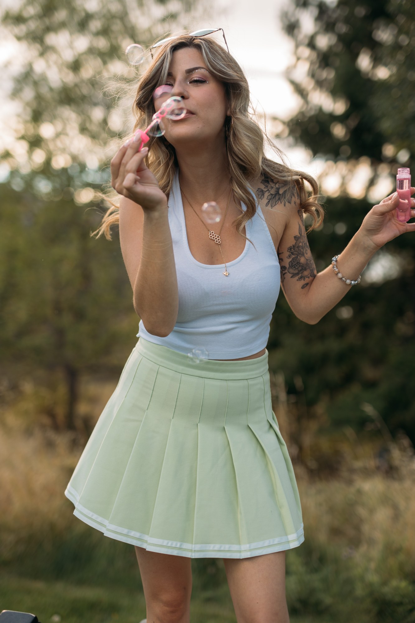 Sophia at Bertram Creek Park: Playful bubble blowing in the first outfit.