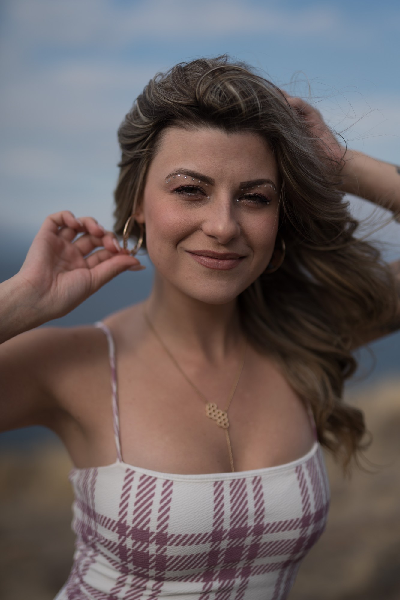 Sophia at Bertram Creek Park: Windblown smiling close portrait.
