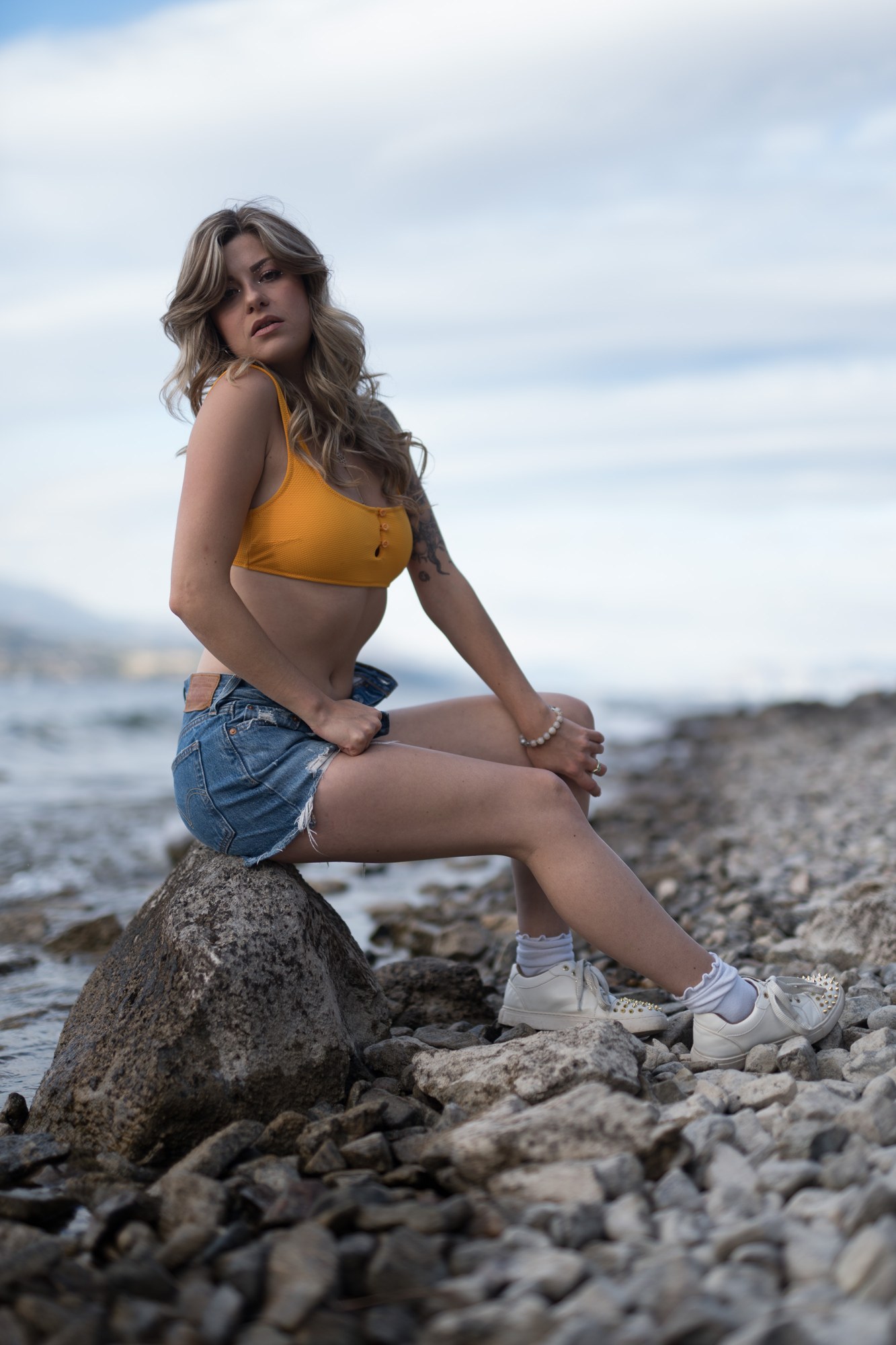 Sophia at Bertram Creek Park: Seated shoreline portrait with face.