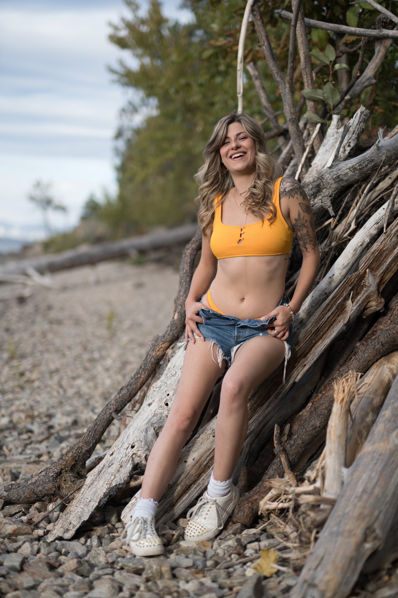 Sophia at Bertram Creek Park: Relaxed standing smile beside exposed roots.