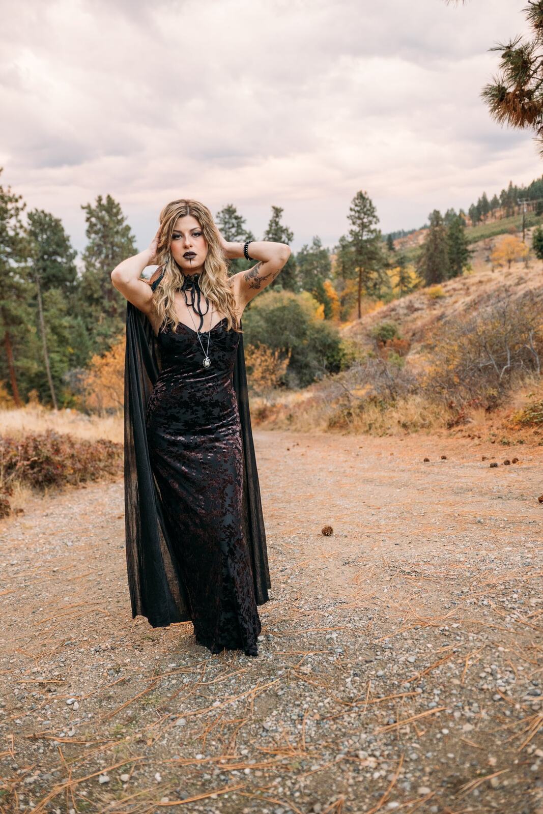 Sophia Halloween portraits story frame 4: A darker seasonal portrait story with candles, rain, rocks, and a little ritual atmosphere.