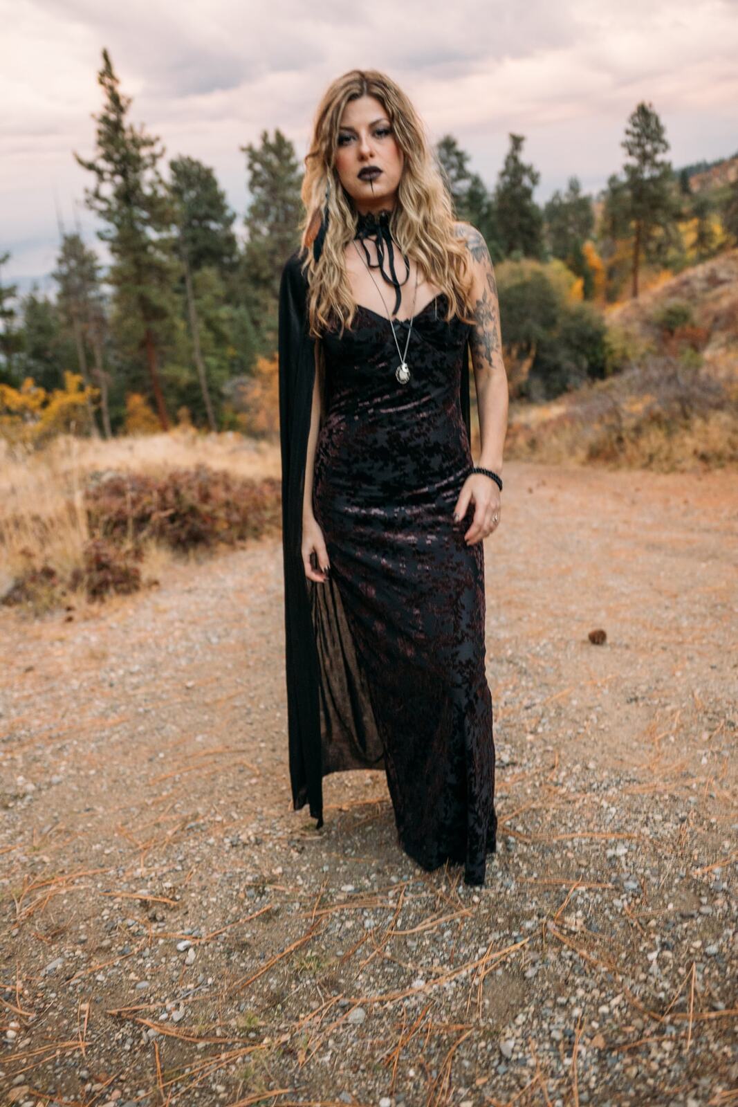 Sophia Halloween portraits story frame 5: A darker seasonal portrait story with candles, rain, rocks, and a little ritual atmosphere.