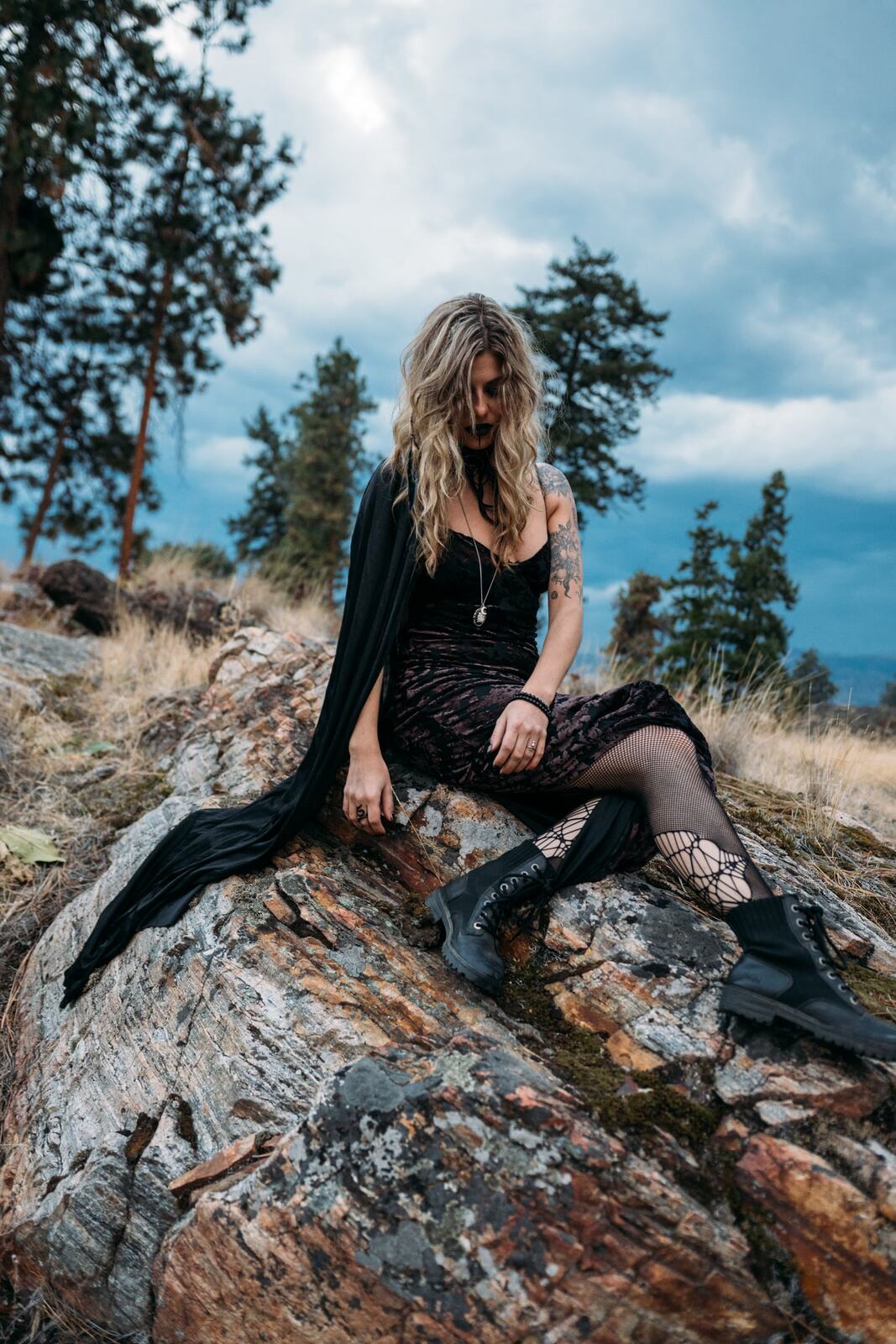 Sophia Halloween portraits story frame 13: A darker seasonal portrait story with candles, rain, rocks, and a little ritual atmosphere.