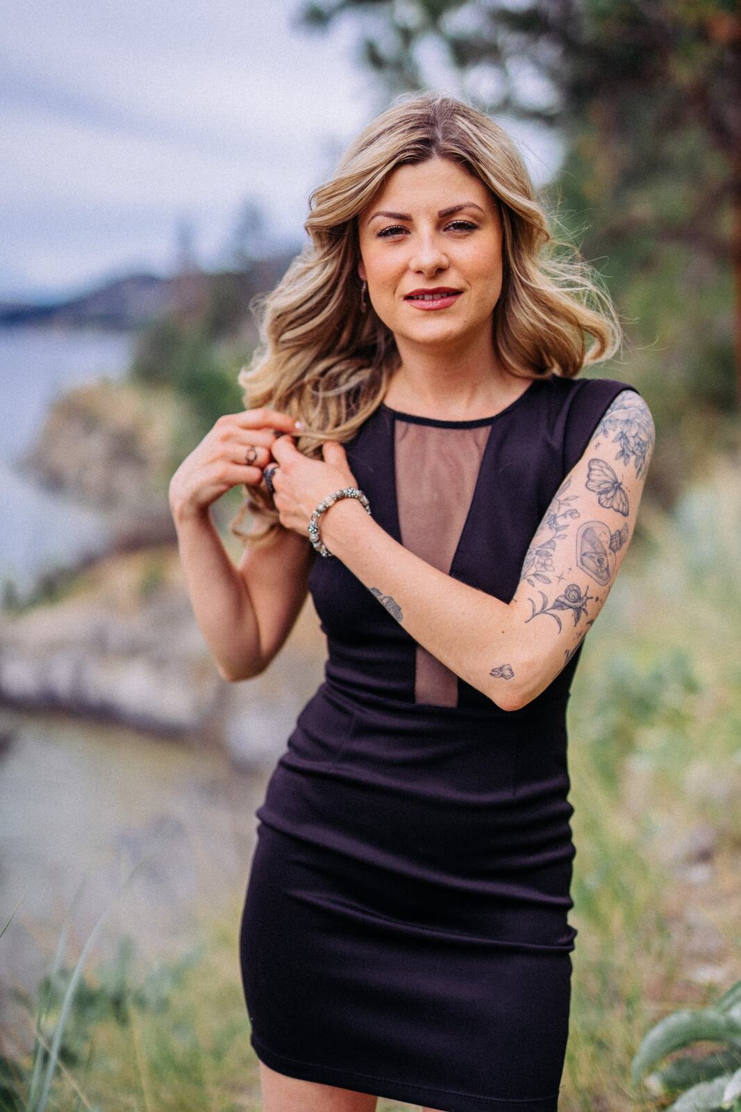 Sophia at Paul's Tomb portraits story frame 11: Lake, rock, trees, wind and a quieter location portrait mood above Okanagan Lake.