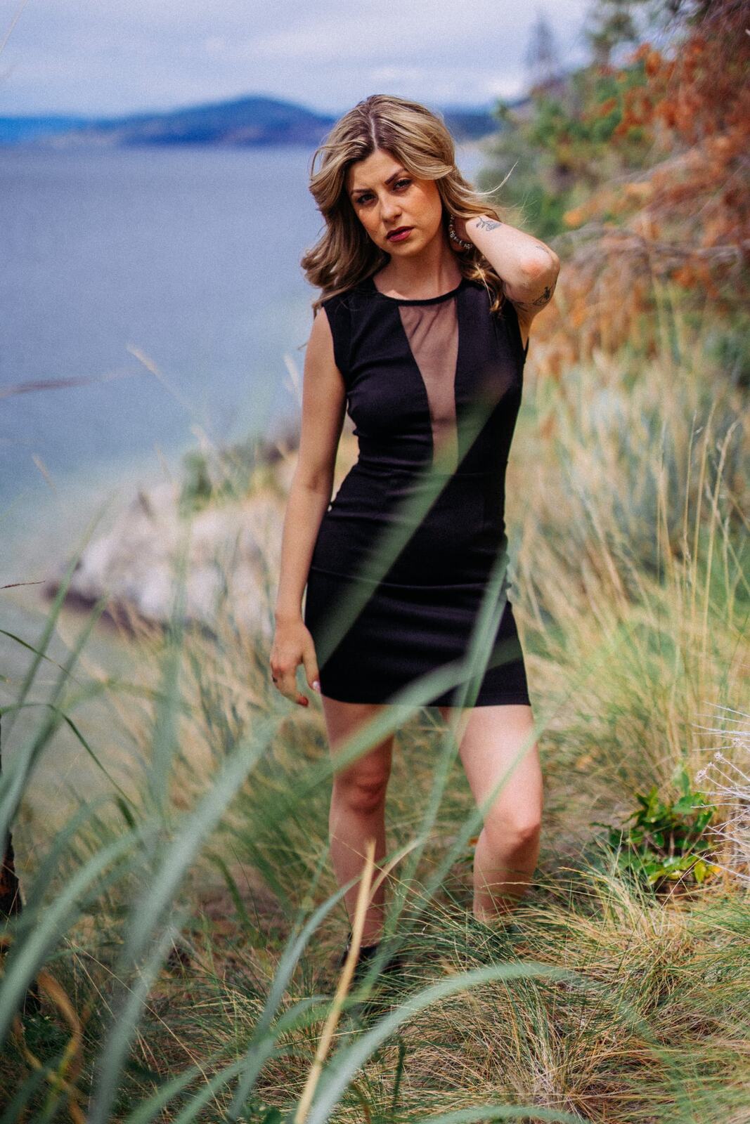 Sophia at Paul's Tomb portraits story frame 18: Lake, rock, trees, wind and a quieter location portrait mood above Okanagan Lake.