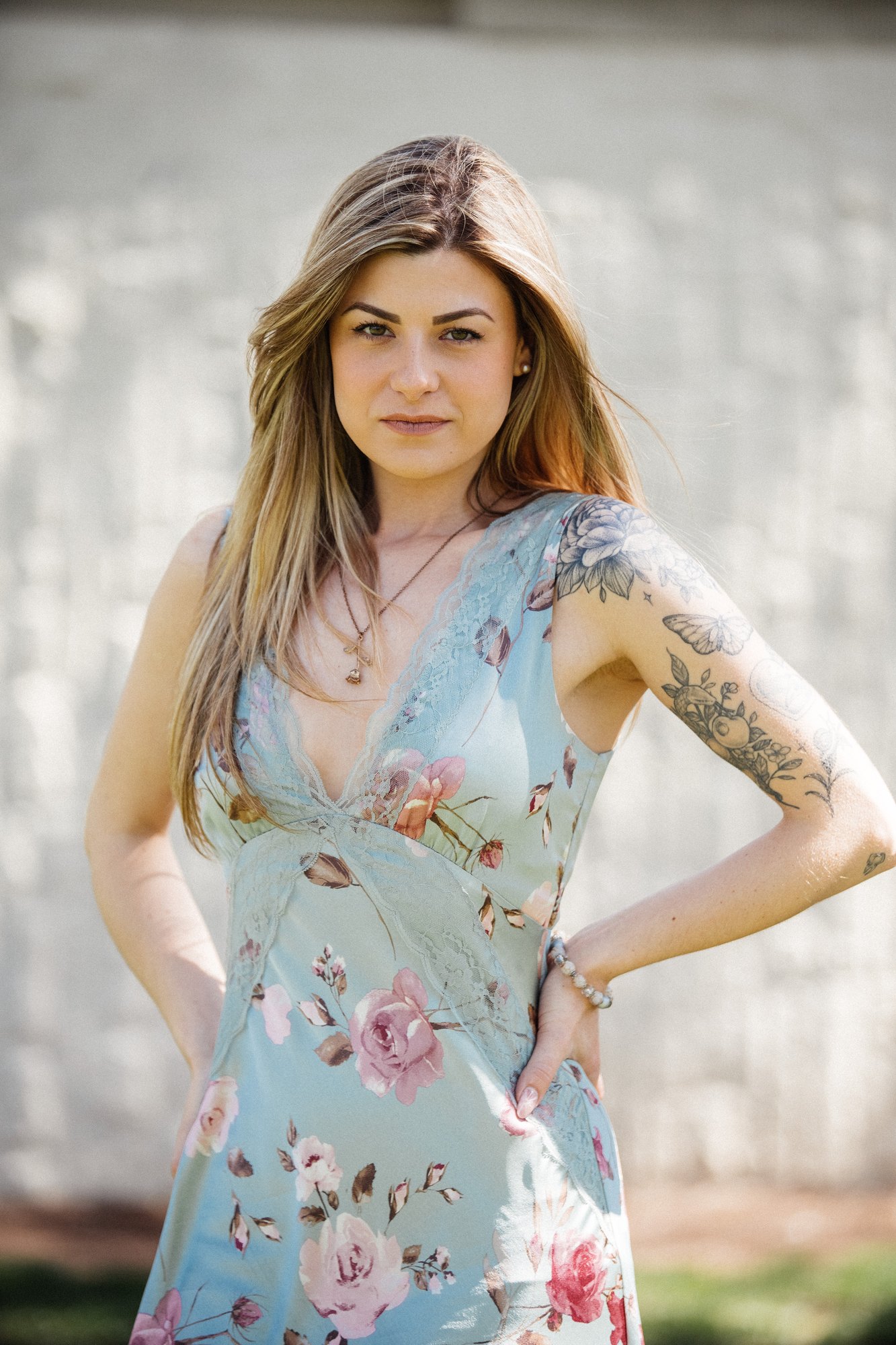 Sophia — direct portrait beside the white wall