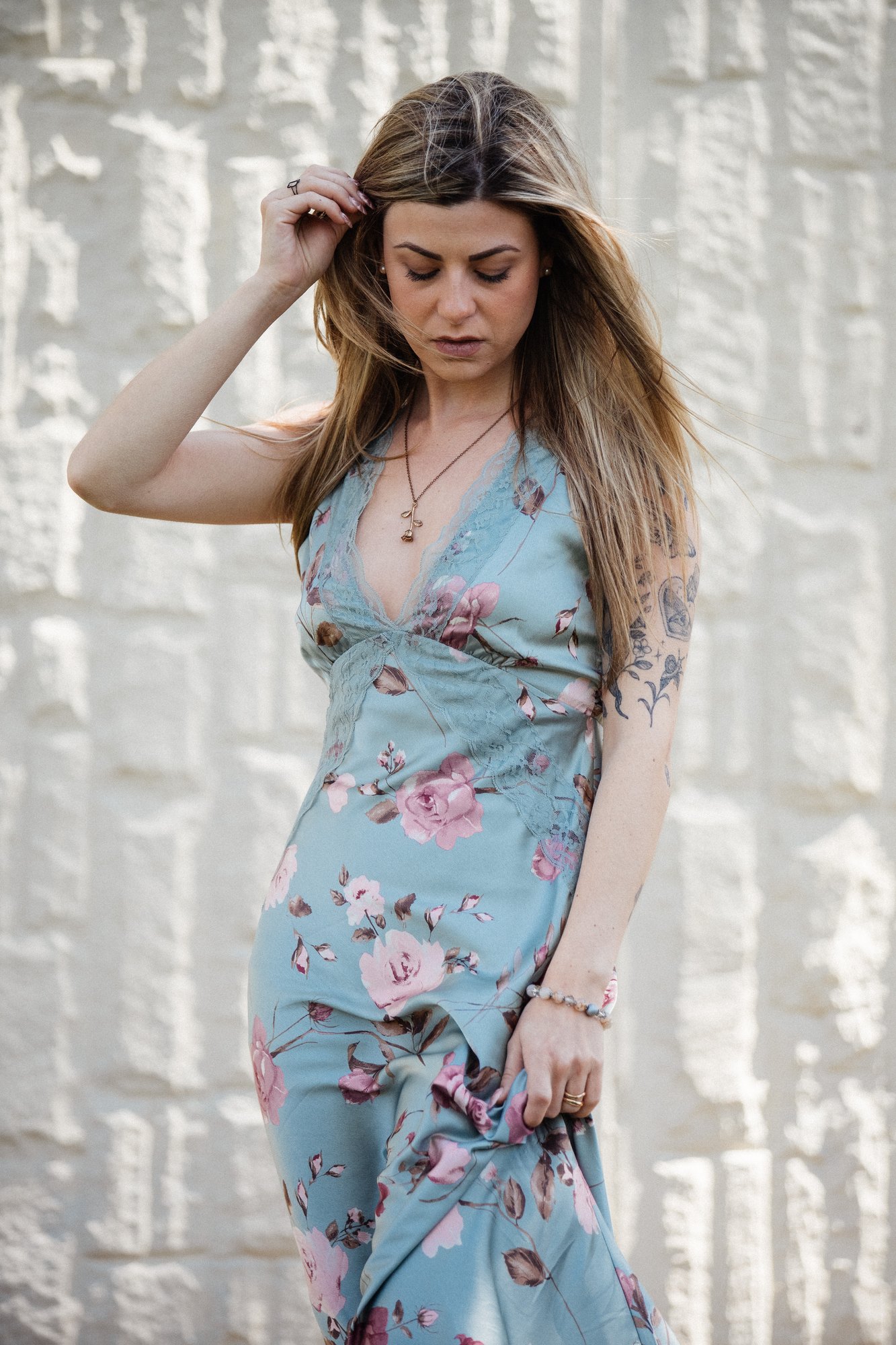 Sophia — looking down with a hand in her hair