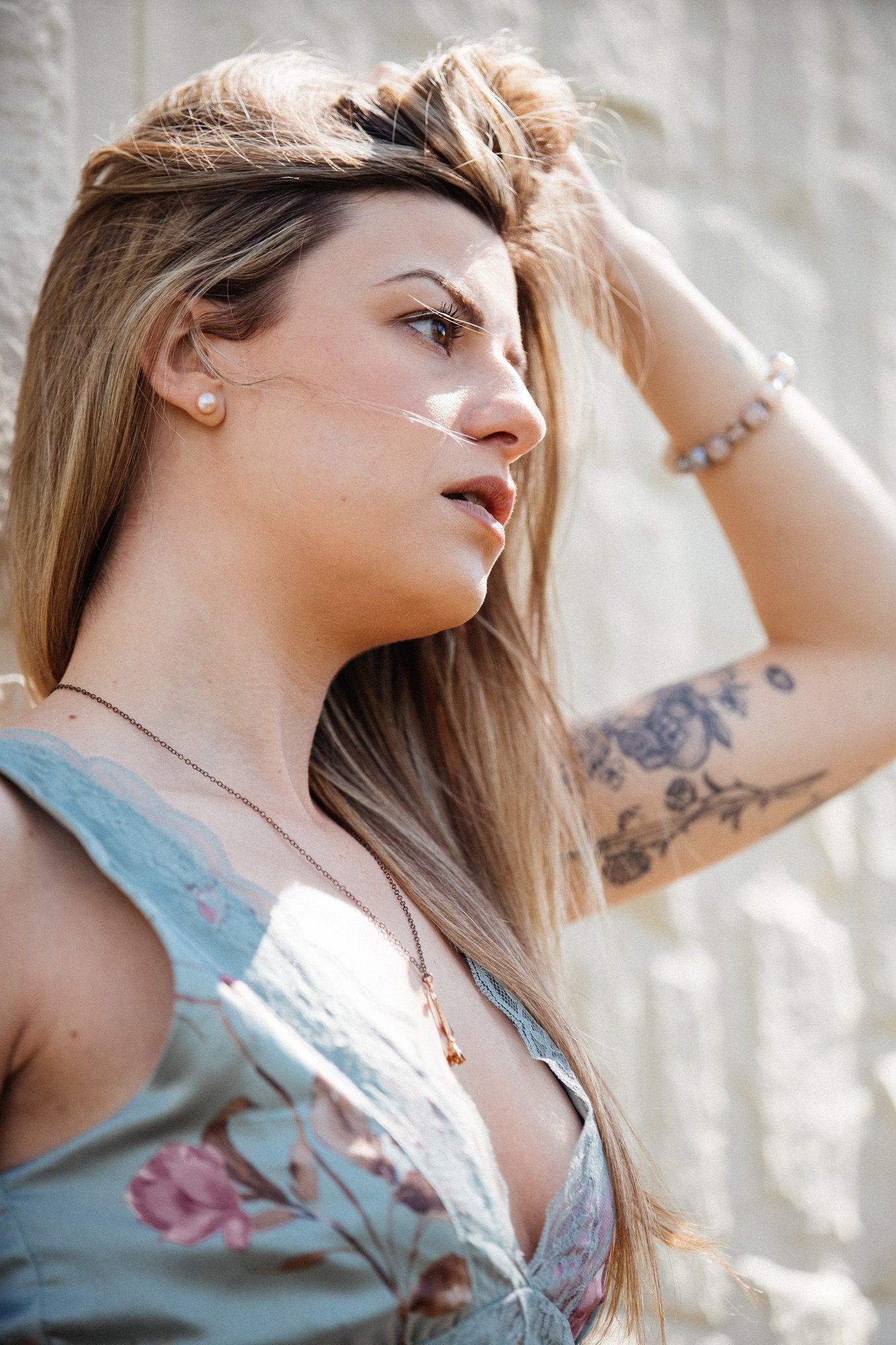Sophia — close side portrait beside the wall