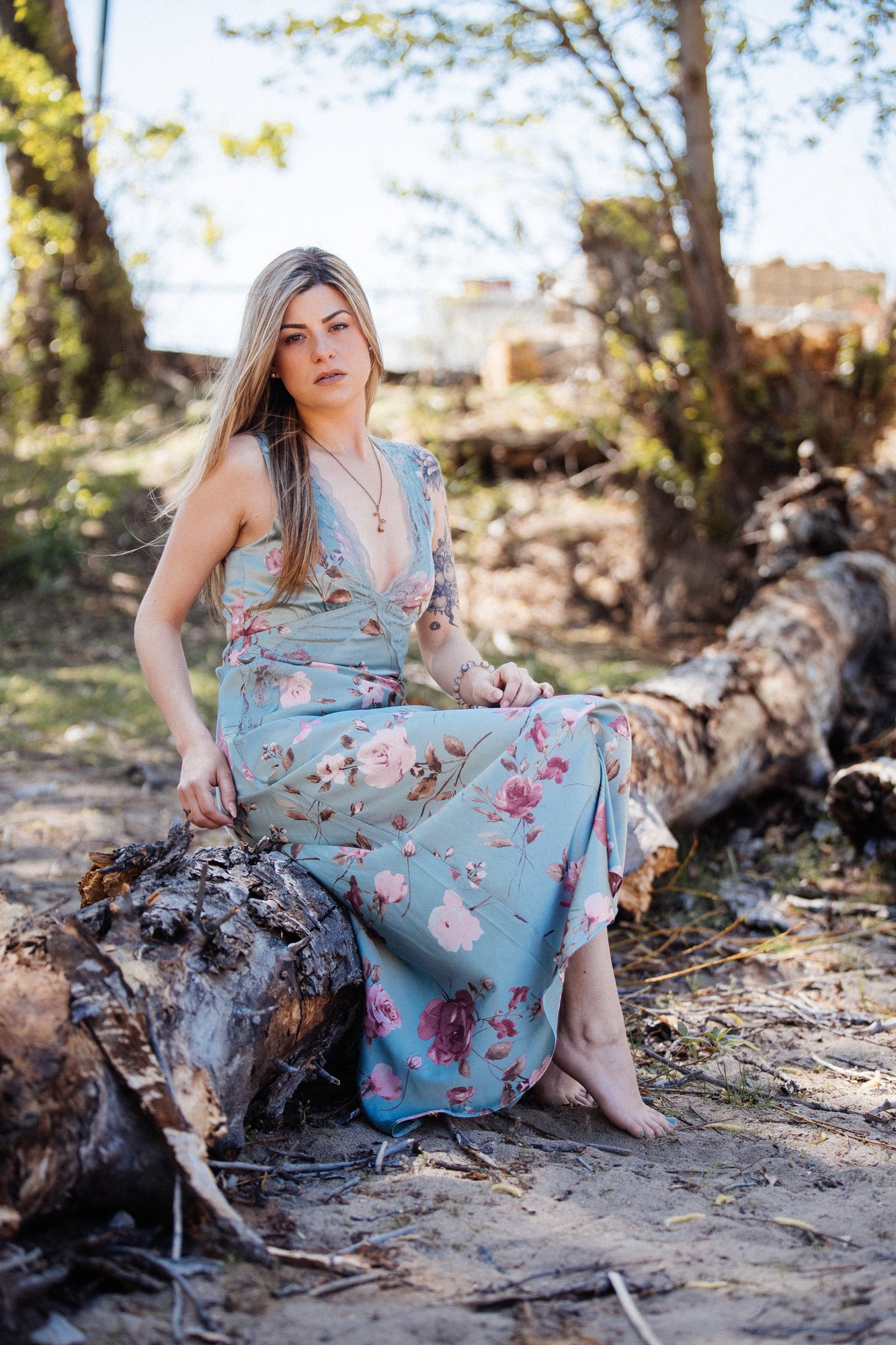 Sophia — a wide seated portrait beneath the trees