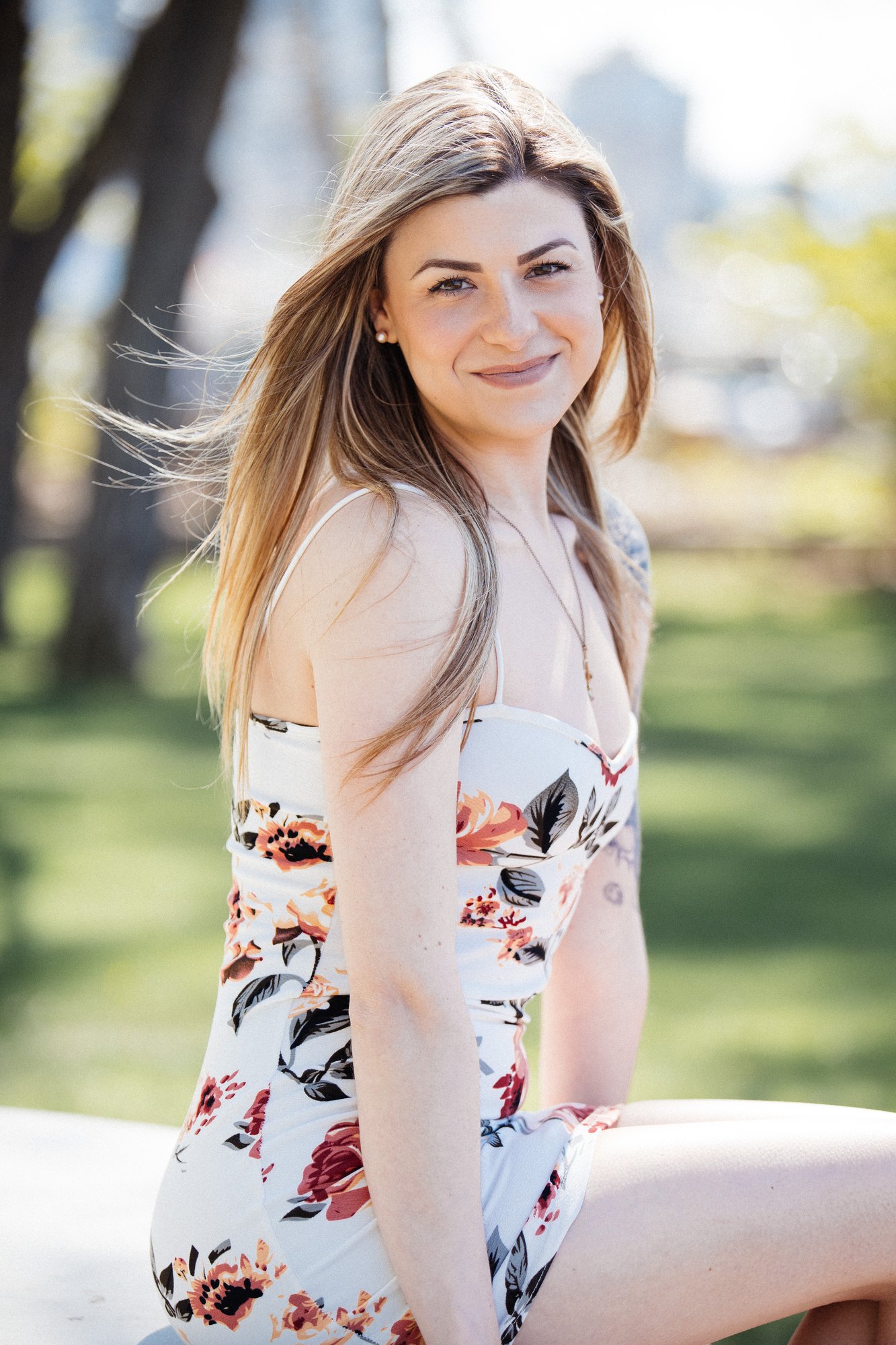 Sophia — a soft smile on the park table