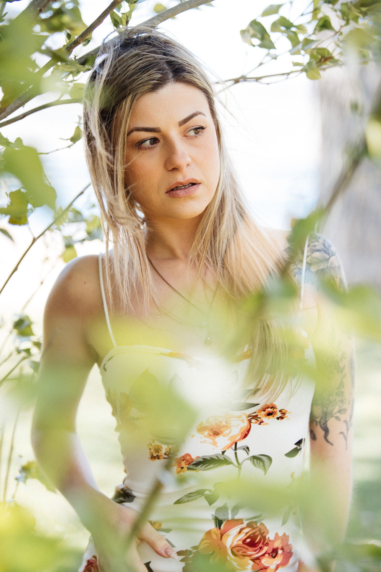 Sophia — a quiet portrait framed by green leaves
