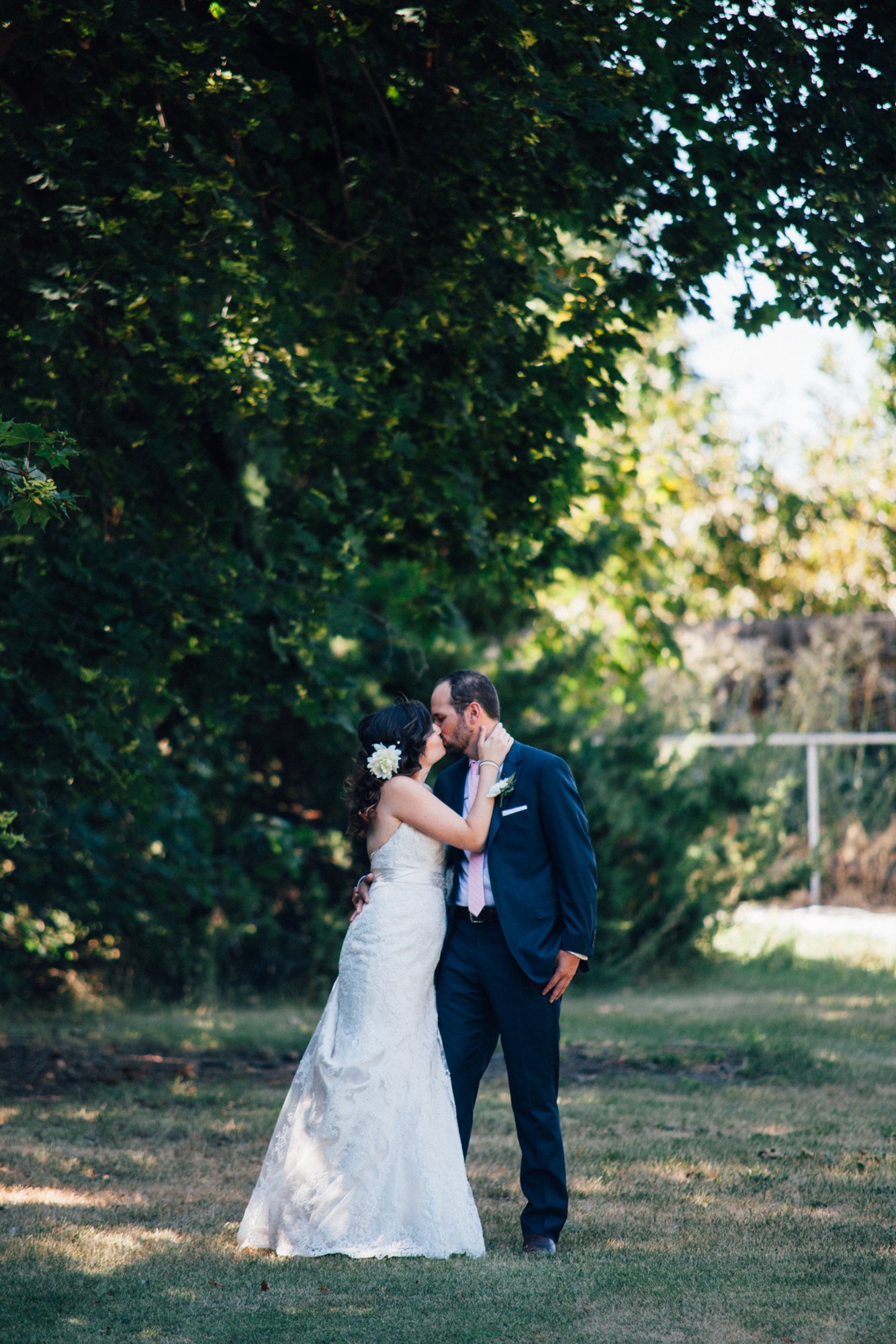 Steph & Taylor: A full-length garden kiss.