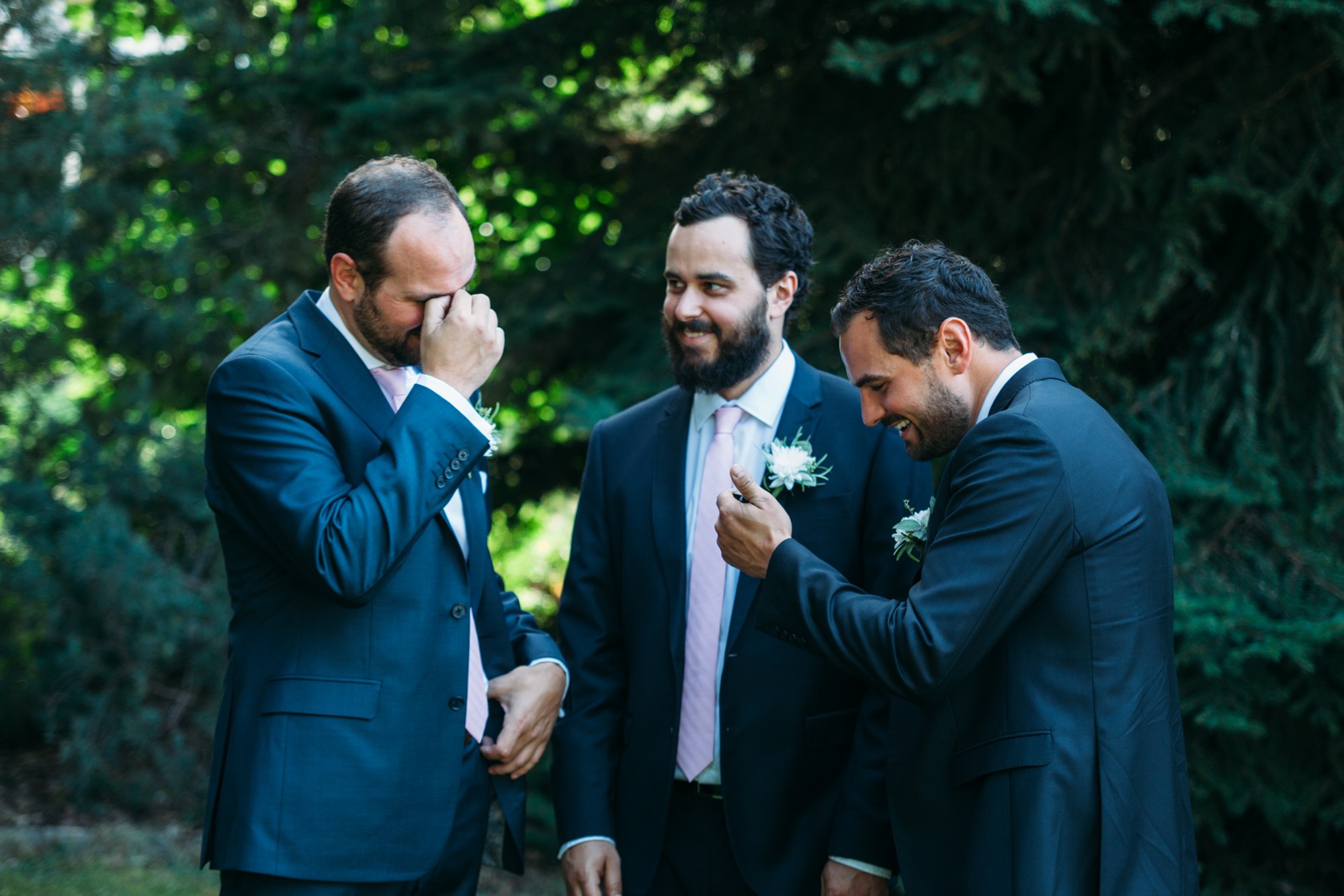 Steph & Taylor: The groomsmen sharing a natural laugh.