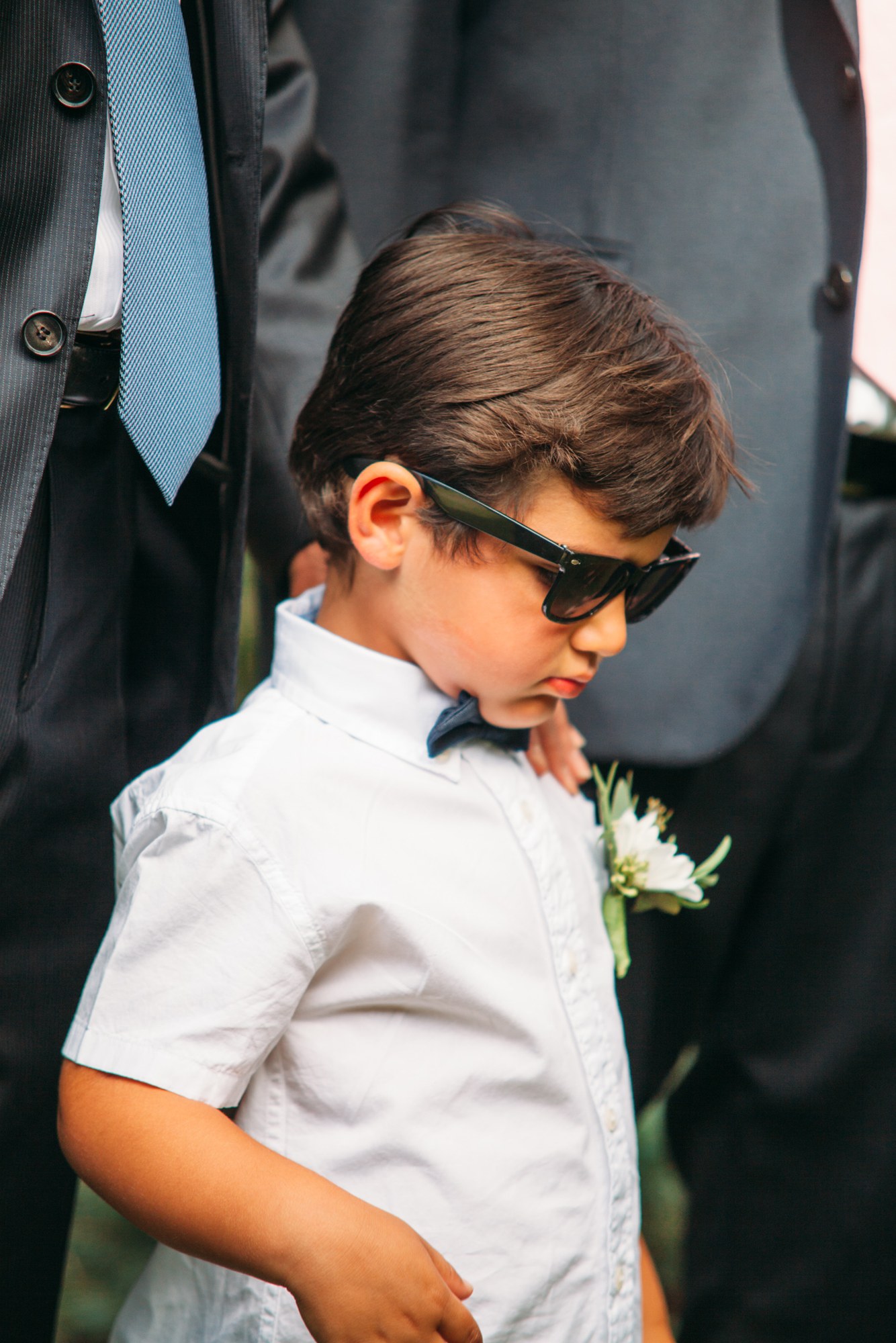 Steph & Taylor: Close portrait of the young guest in sunglasses.