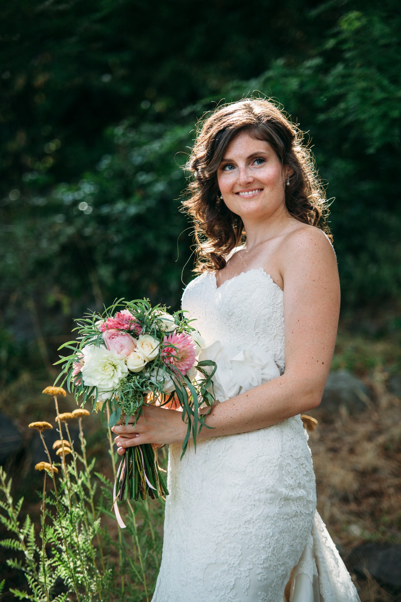 Steph & Taylor: Warm smiling portrait of the bride.