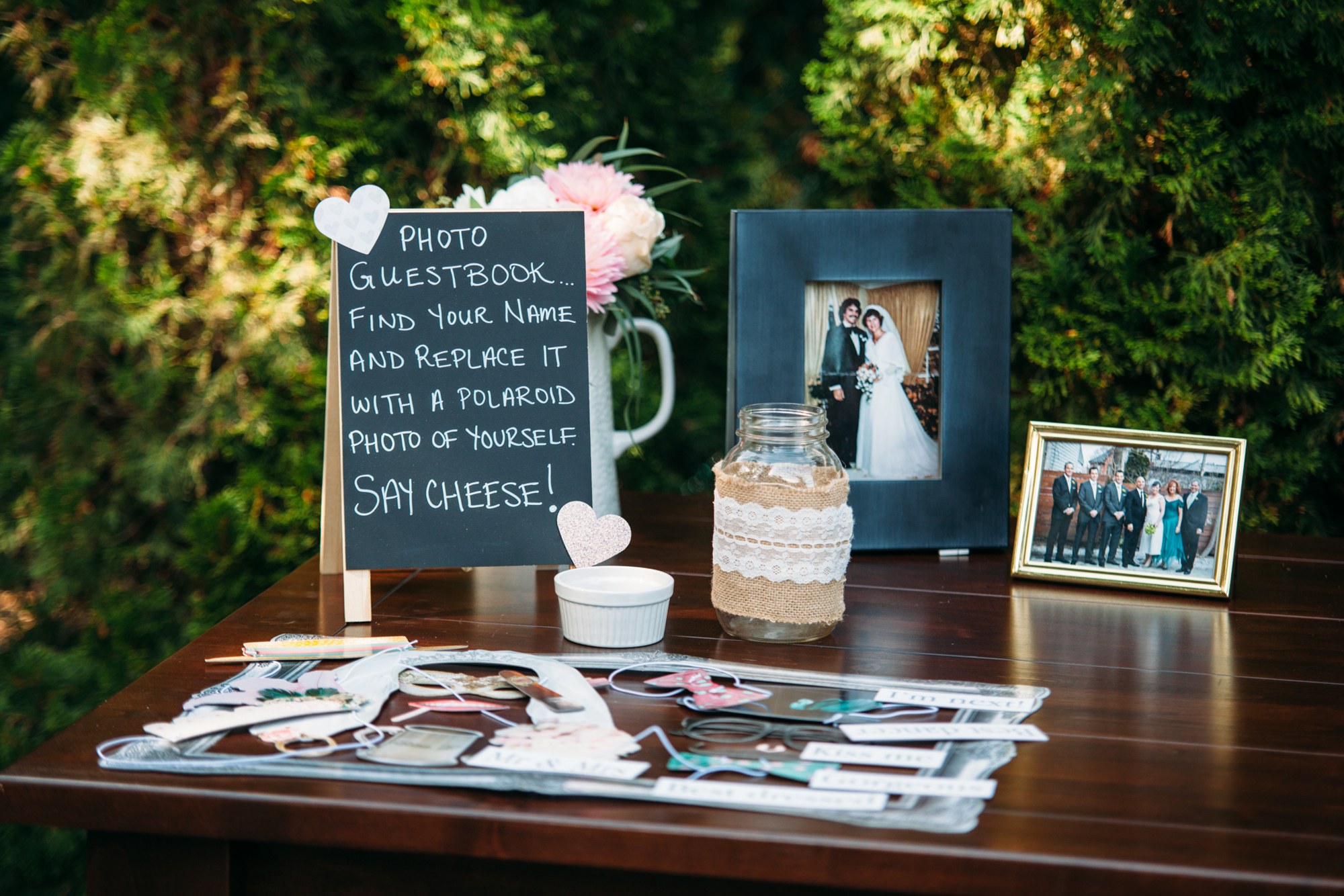 Steph & Taylor: The wedding guestbook and photographs ready on the table.