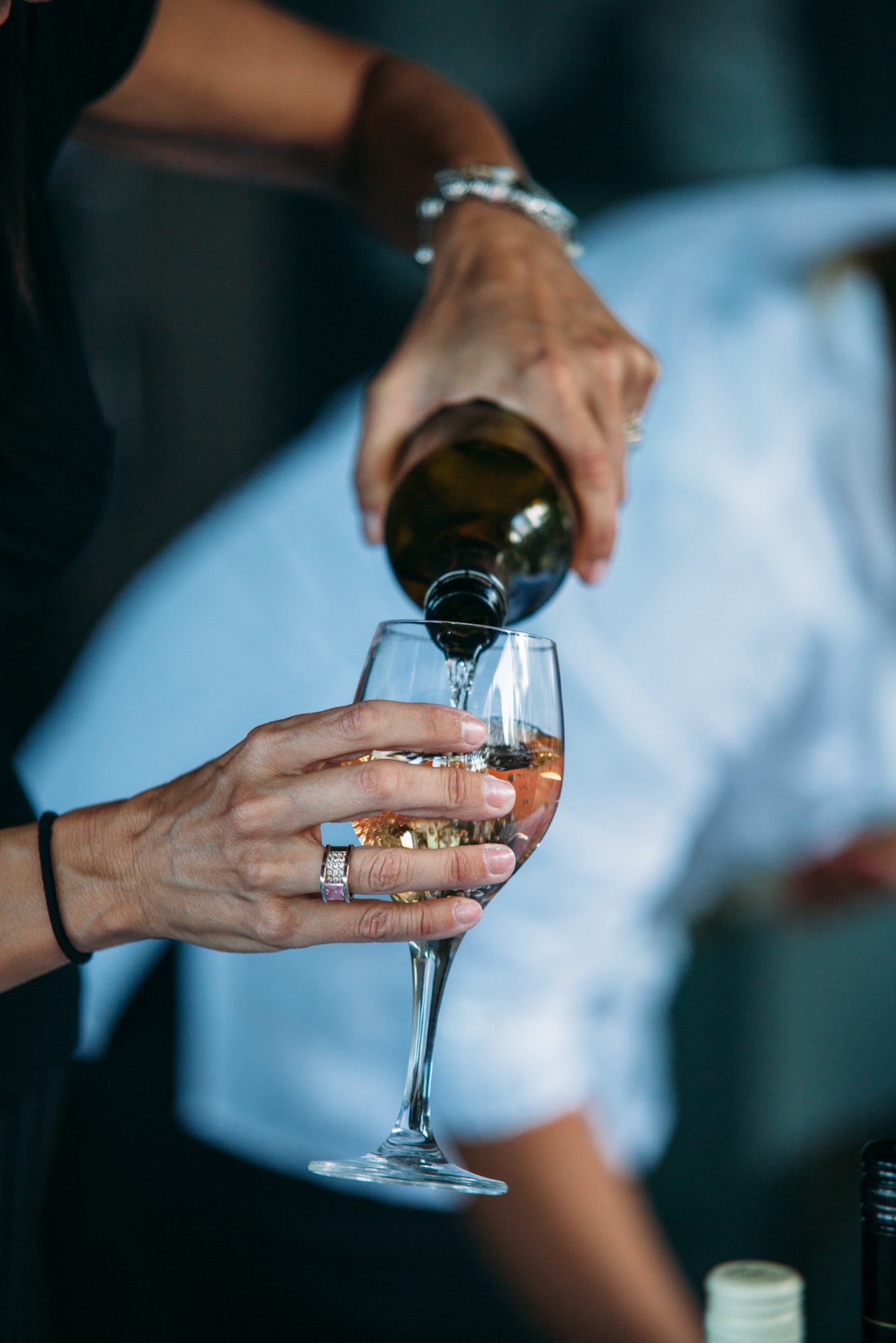 Steph & Taylor: Wine being poured into a guest’s glass.