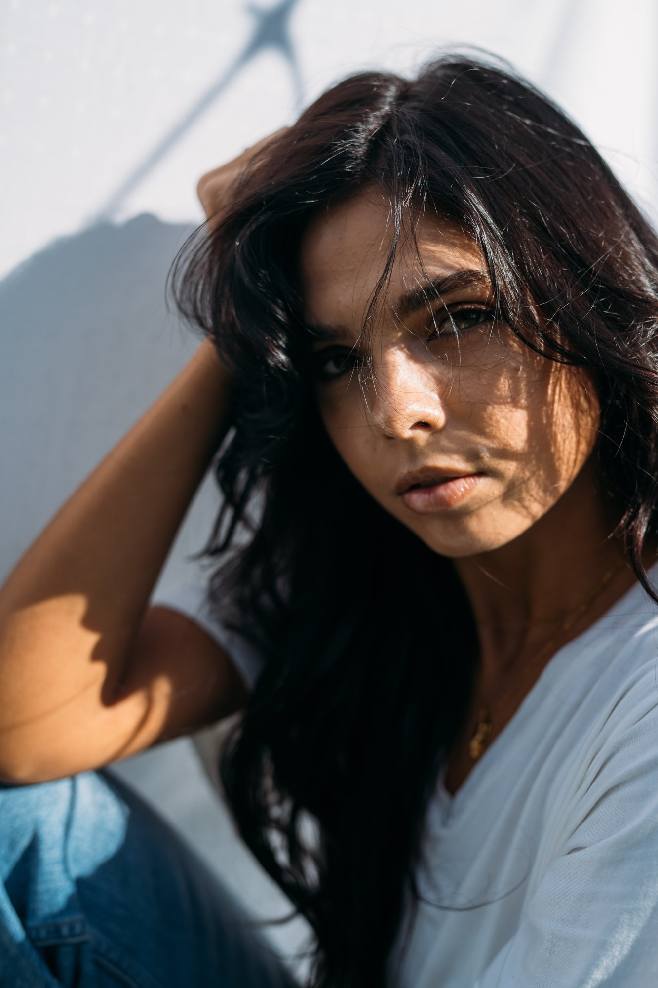 Sunny in Sunlight: Close portrait with hair and angled sunlight.