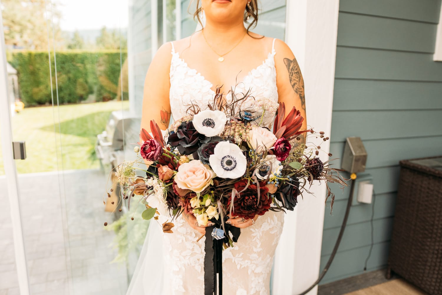 Taryn and Kai weddings story frame 8: An Okanagan vineyard wedding with ceremony, veil, guests, family, makeup by Guisachan Esthetics, and laughter woven through the altar moments..