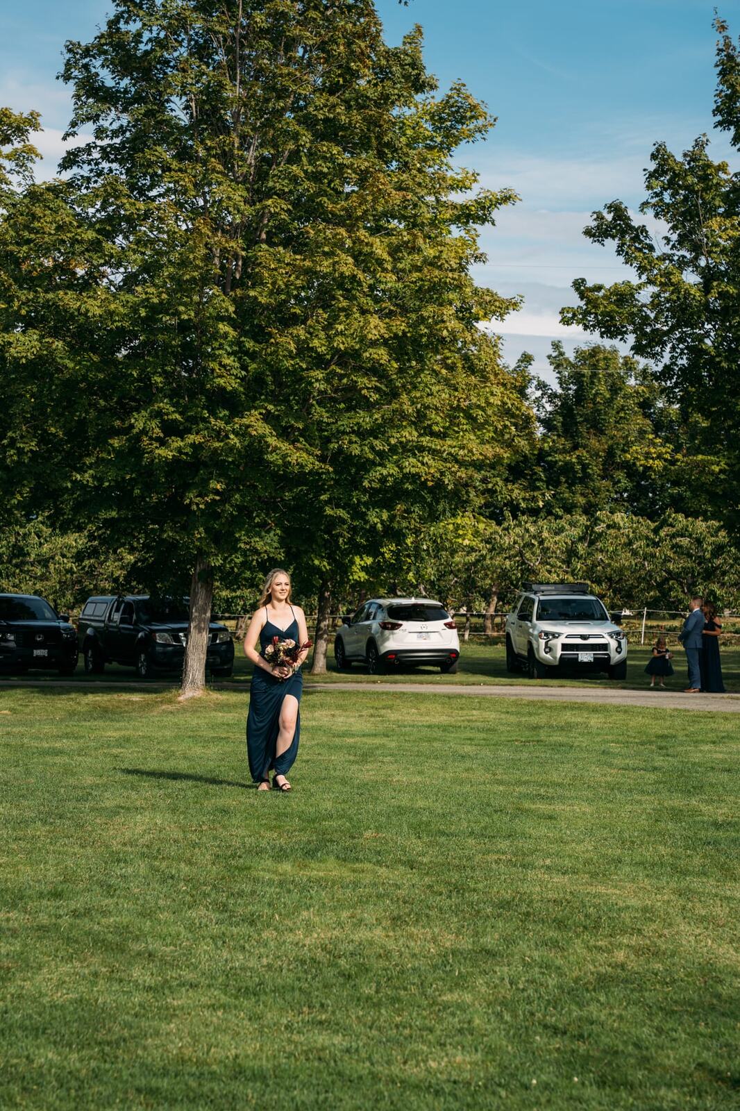 Taryn and Kai weddings story frame 15: An Okanagan vineyard wedding with ceremony, veil, guests, family, makeup by Guisachan Esthetics, and laughter woven through the altar moments..