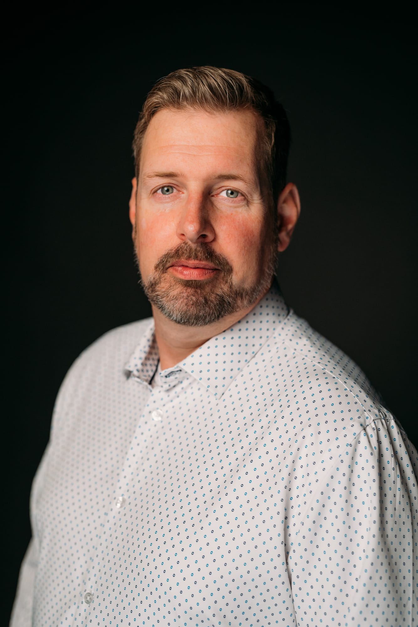 Team Bennett corporate story frame 1: Real estate team portraits at Kelowna Film Studios, with individual headshots, group photos and clean marketing images for profiles, listings and business use..