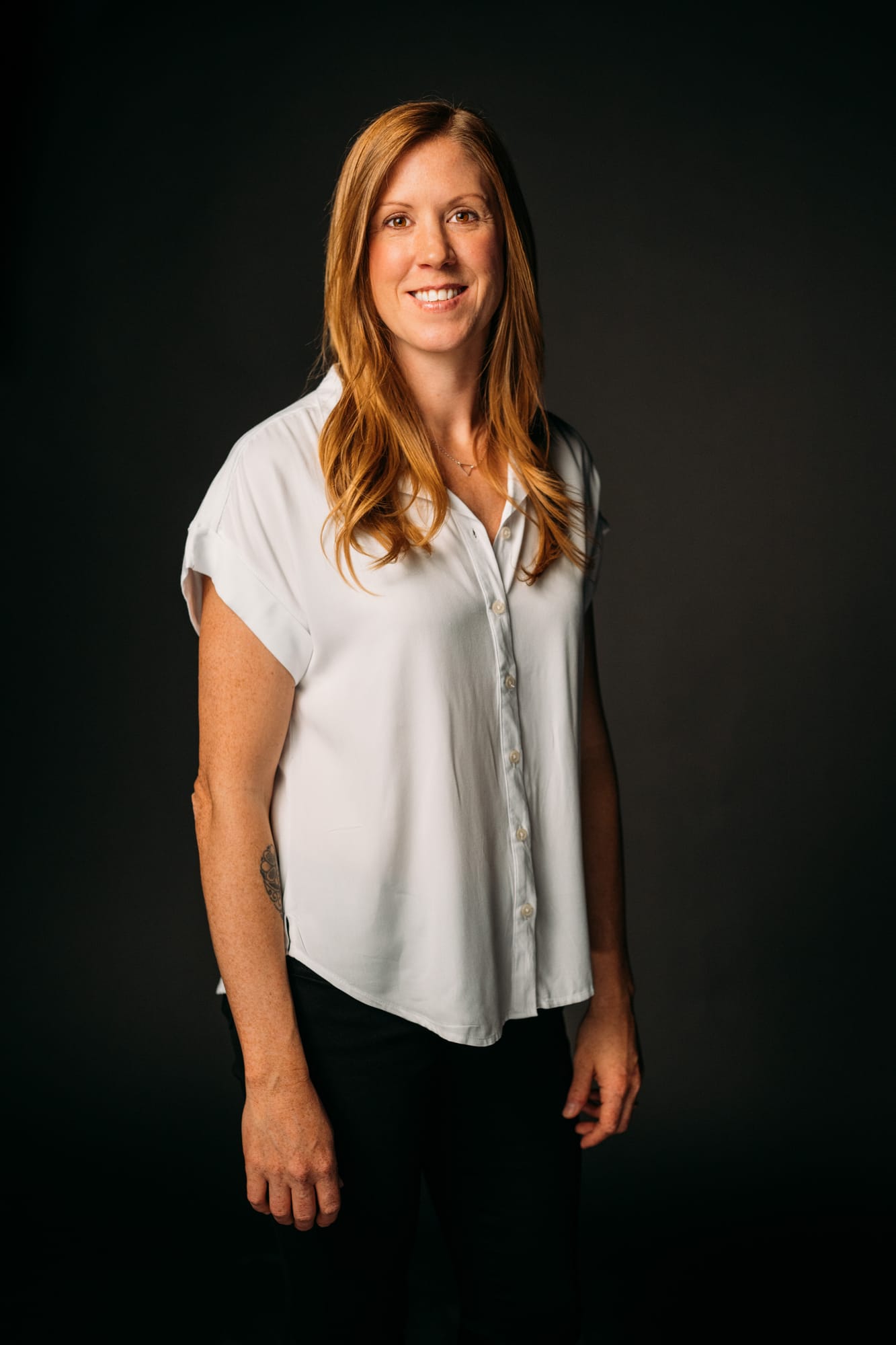 Team Bennett corporate story frame 6: Real estate team portraits at Kelowna Film Studios, with individual headshots, group photos and clean marketing images for profiles, listings and business use..