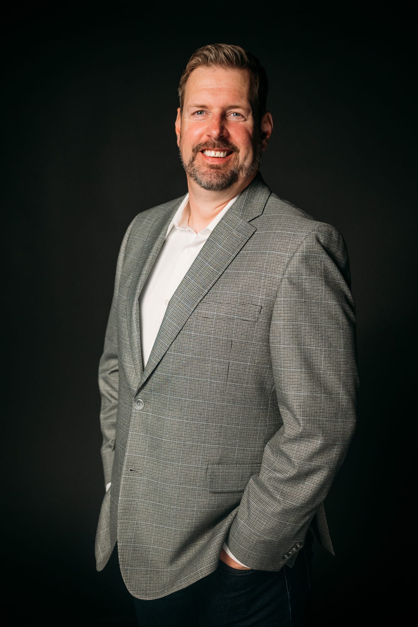 Team Bennett corporate story frame 9: Real estate team portraits at Kelowna Film Studios, with individual headshots, group photos and clean marketing images for profiles, listings and business use..