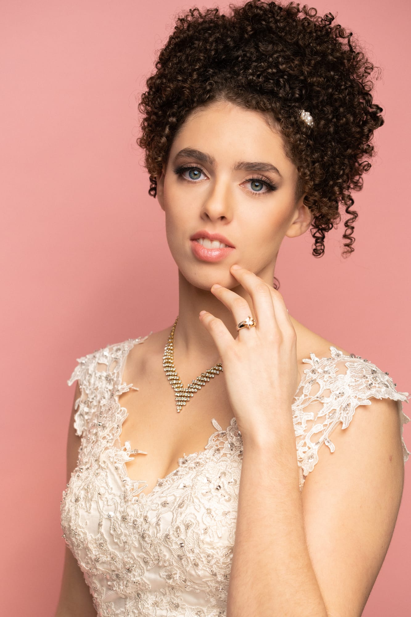 The Barbershoppe / Diva Den Bridal Formals corporate story frame 2: Collaborative bridal-formal brand photography for The Barbershoppe and Diva Den Day Spa at Kelowna Film Studios, with hair, makeup, formal looks, studio portraits and campaign-ready beauty imagery..