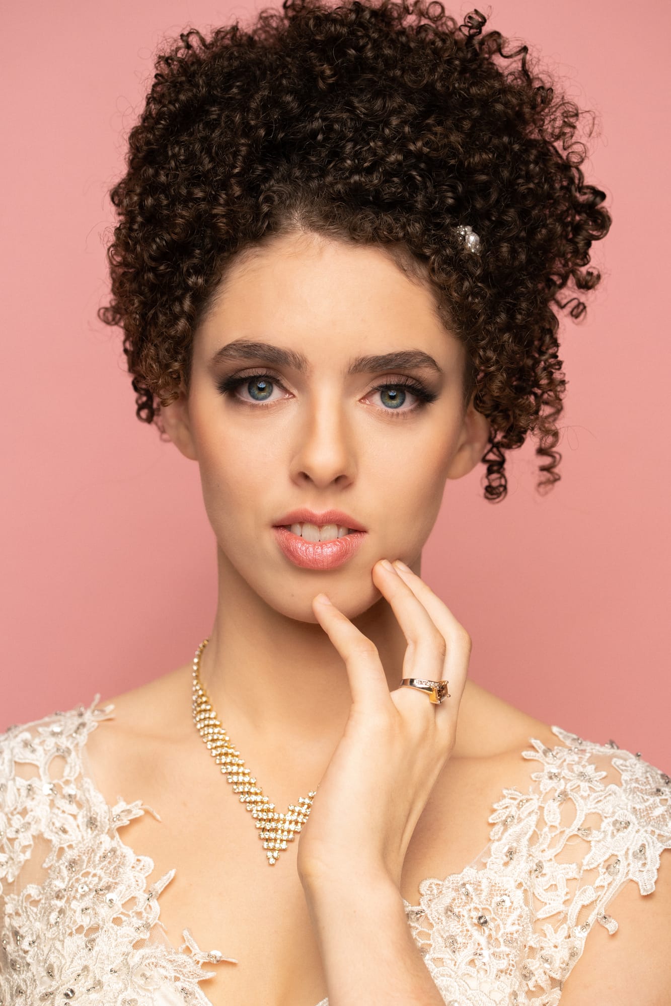 The Barbershoppe / Diva Den Bridal Formals corporate story frame 4: Collaborative bridal-formal brand photography for The Barbershoppe and Diva Den Day Spa at Kelowna Film Studios, with hair, makeup, formal looks, studio portraits and campaign-ready beauty imagery..