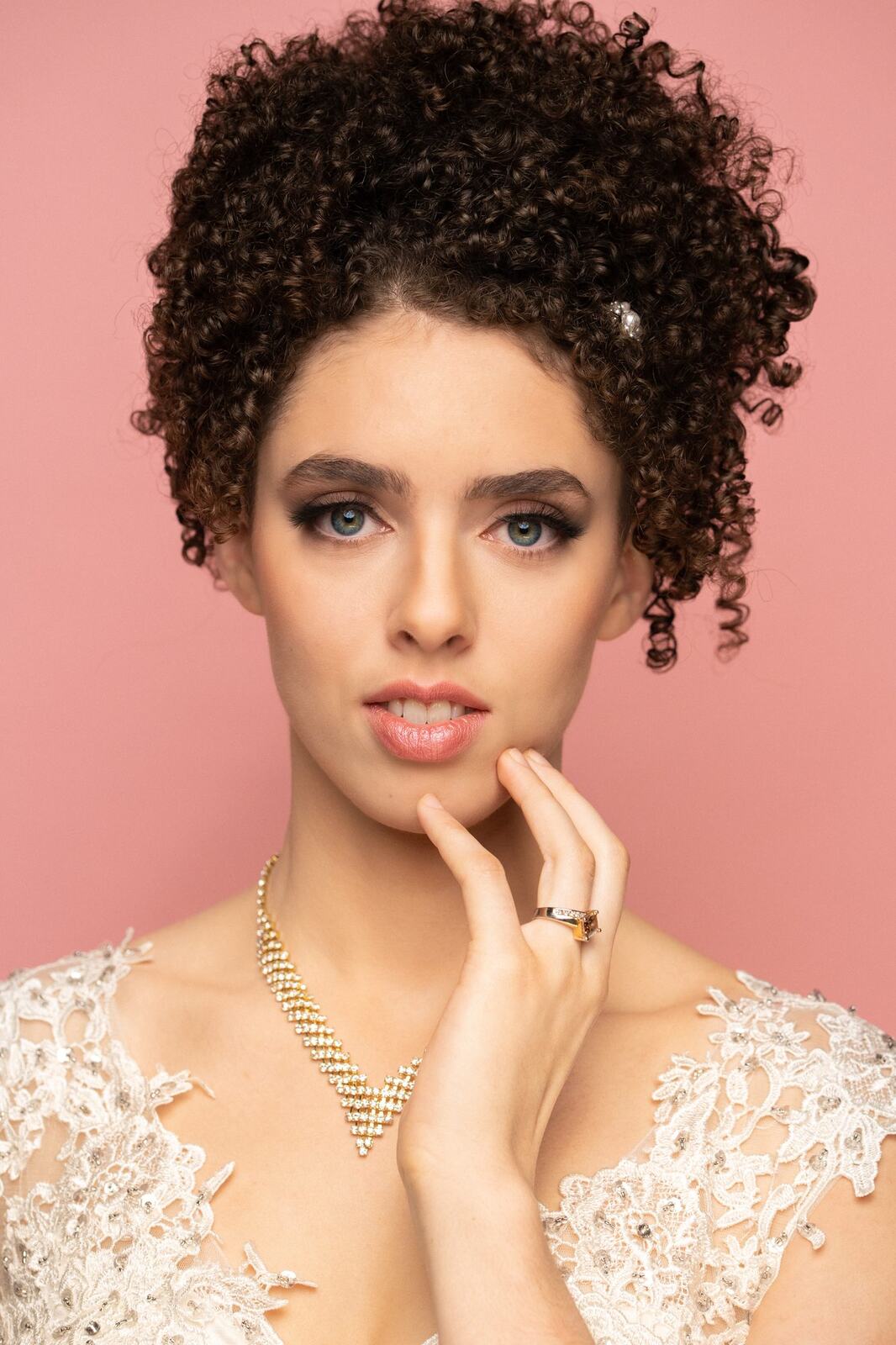 The Barbershoppe / Diva Den Bridal Formals corporate story frame 4: Collaborative bridal-formal brand photography for The Barbershoppe and Diva Den Day Spa, with hair, makeup, formal looks, studio portraits and campaign-ready beauty imagery..