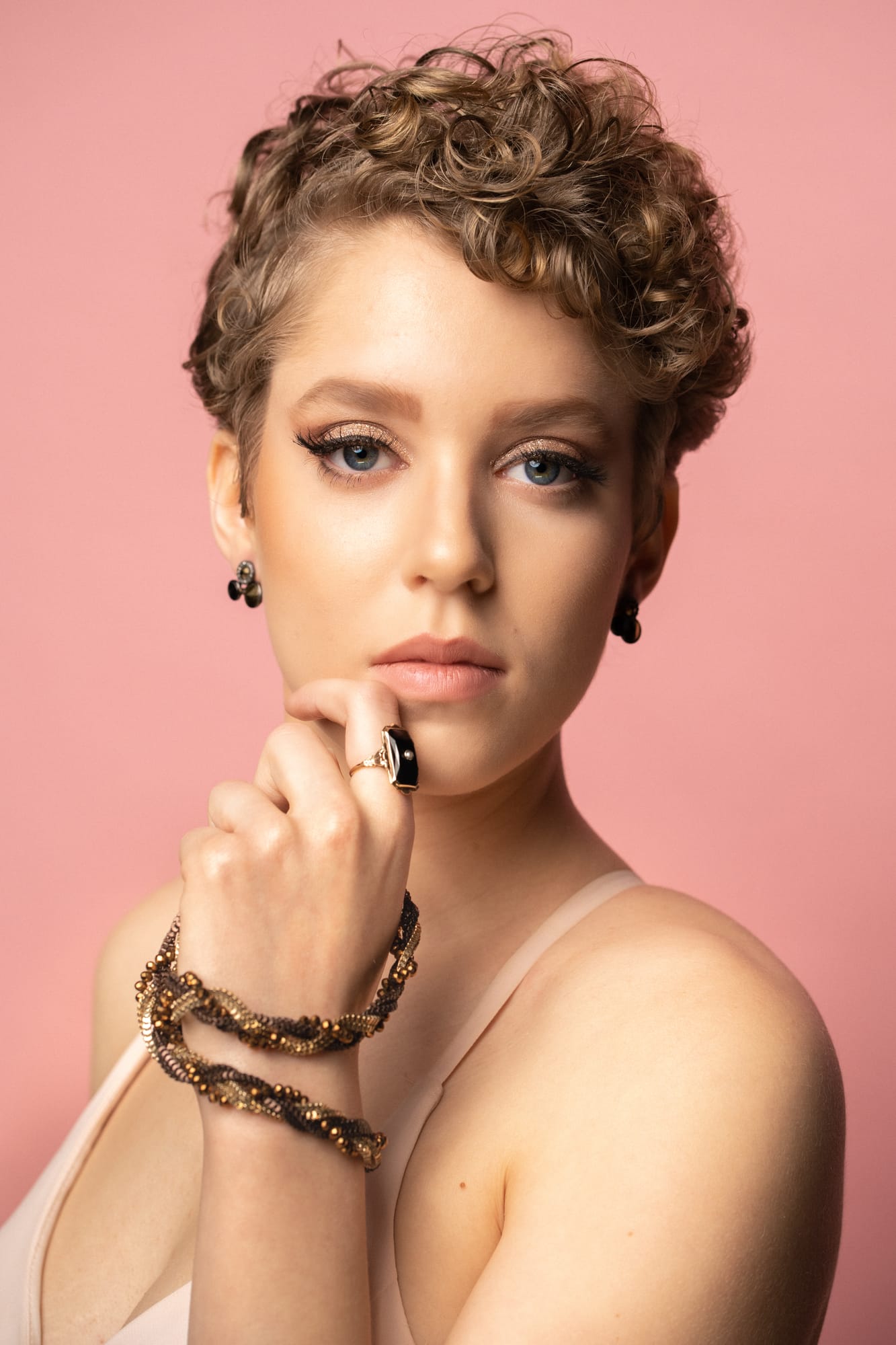 The Barbershoppe / Diva Den Bridal Formals corporate story frame 22: Collaborative bridal-formal brand photography for The Barbershoppe and Diva Den Day Spa at Kelowna Film Studios, with hair, makeup, formal looks, studio portraits and campaign-ready beauty imagery..