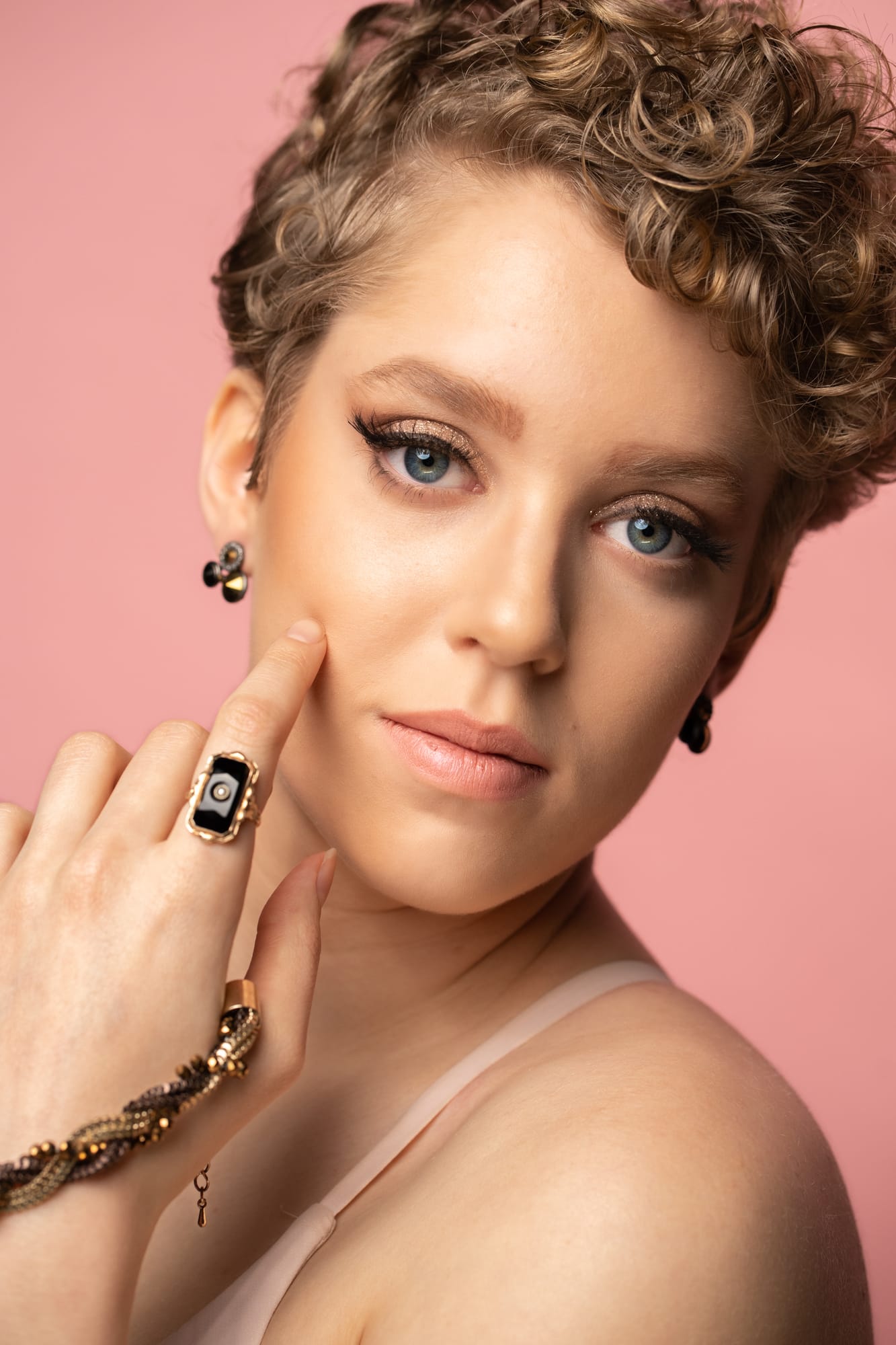 The Barbershoppe / Diva Den Bridal Formals corporate story frame 25: Collaborative bridal-formal brand photography for The Barbershoppe and Diva Den Day Spa at Kelowna Film Studios, with hair, makeup, formal looks, studio portraits and campaign-ready beauty imagery..